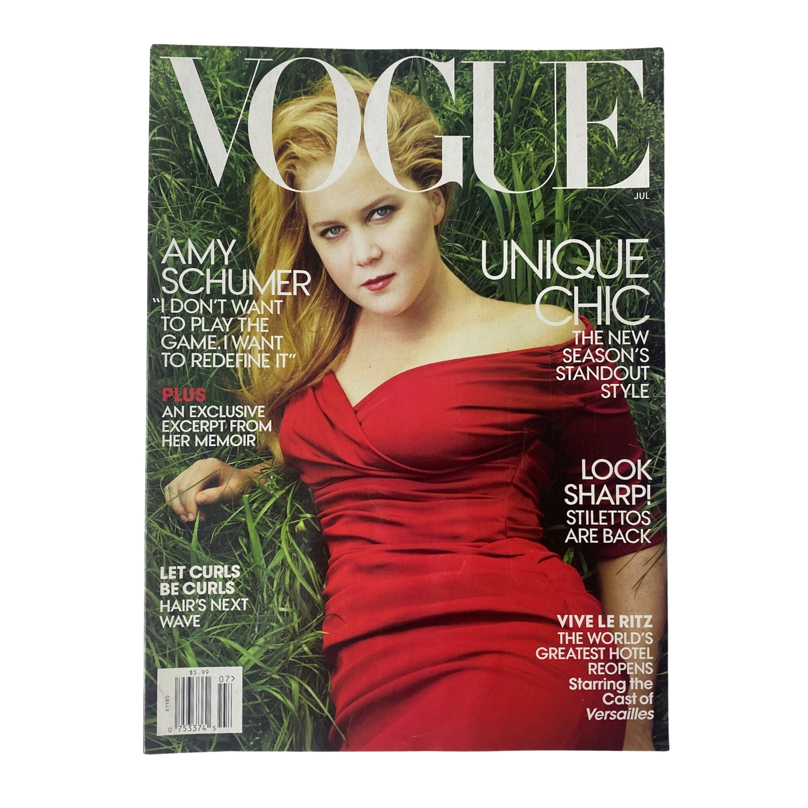 Cover of Vogue Magazine July 2016 featuring Amy Schumer in a striking red dress, highlighting her feature story as comedy's bold new voice.
