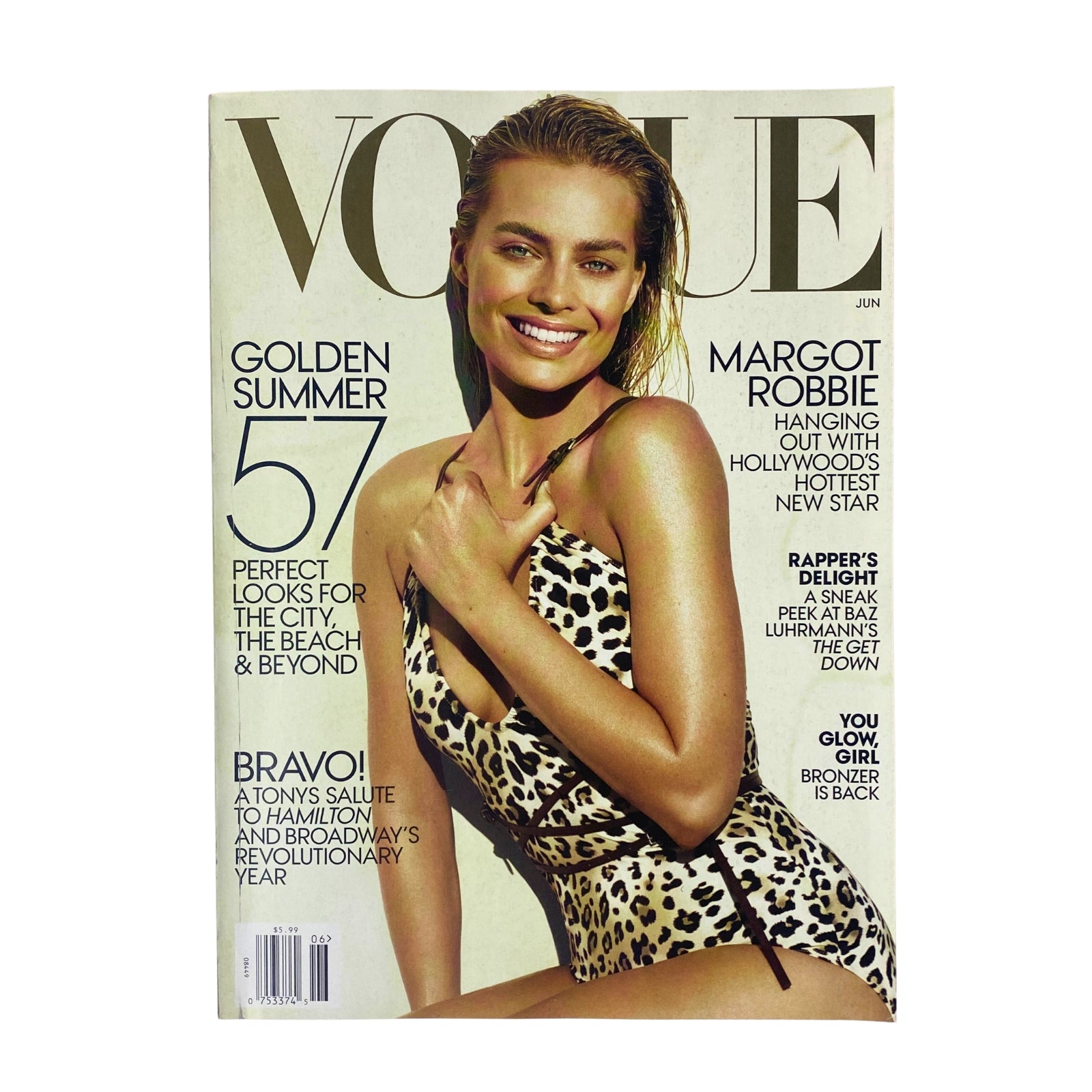 Vogue Magazine June 2016 featuring Margot Robbie on the cover in a stylish swimsuit, celebrating summer fashion trends.