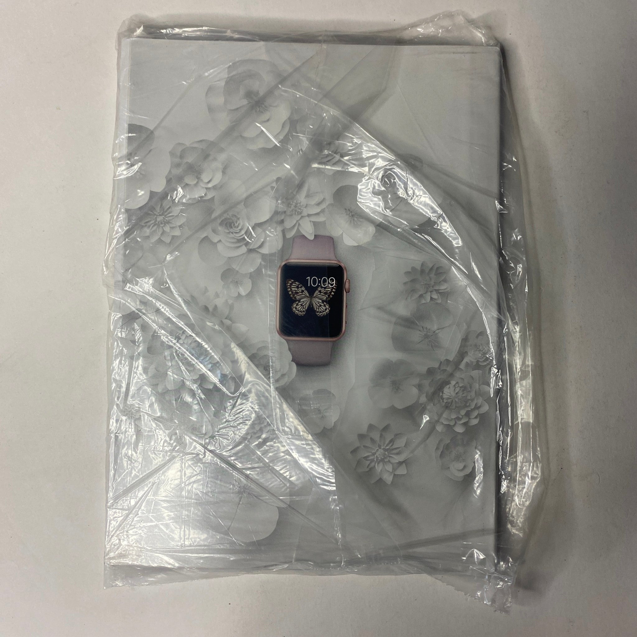 Back cover of Vogue Magazine April 2016, showcasing intricate floral designs with a smartwatch displayed, brand new and sealed.