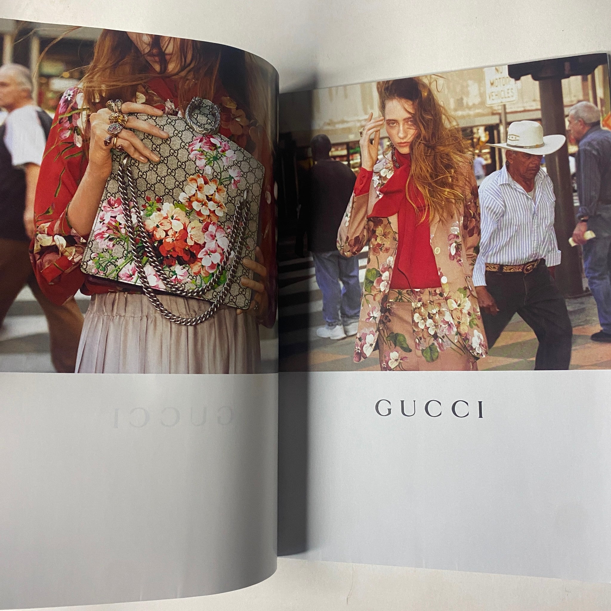 Gucci advertisement spread from Vogue Magazine July 2015, showcasing floral designs in clothing and accessories, exemplifying summer fashion themes.