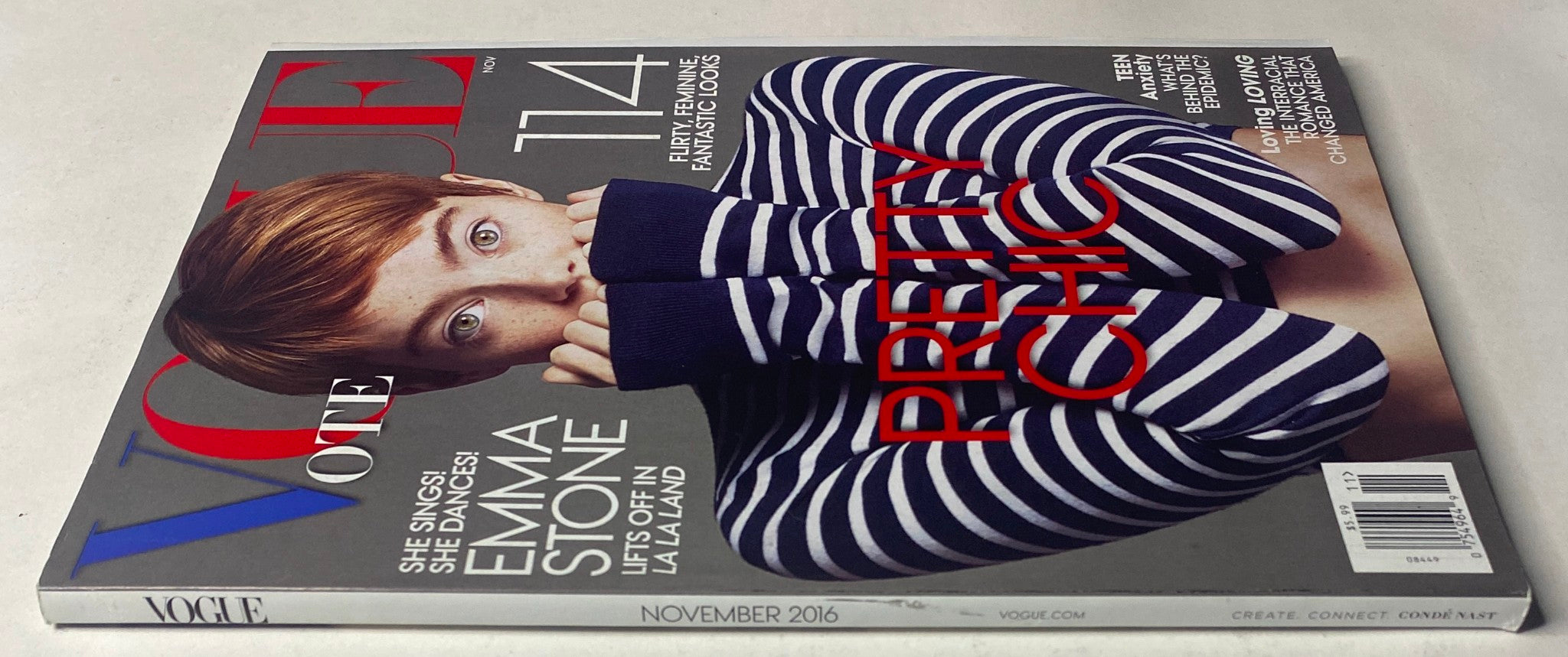 Side view of Vogue Magazine November 2016, highlighting Emma Stone on the cover in a chic striped outfit, labeled 'Pretty Chic'.