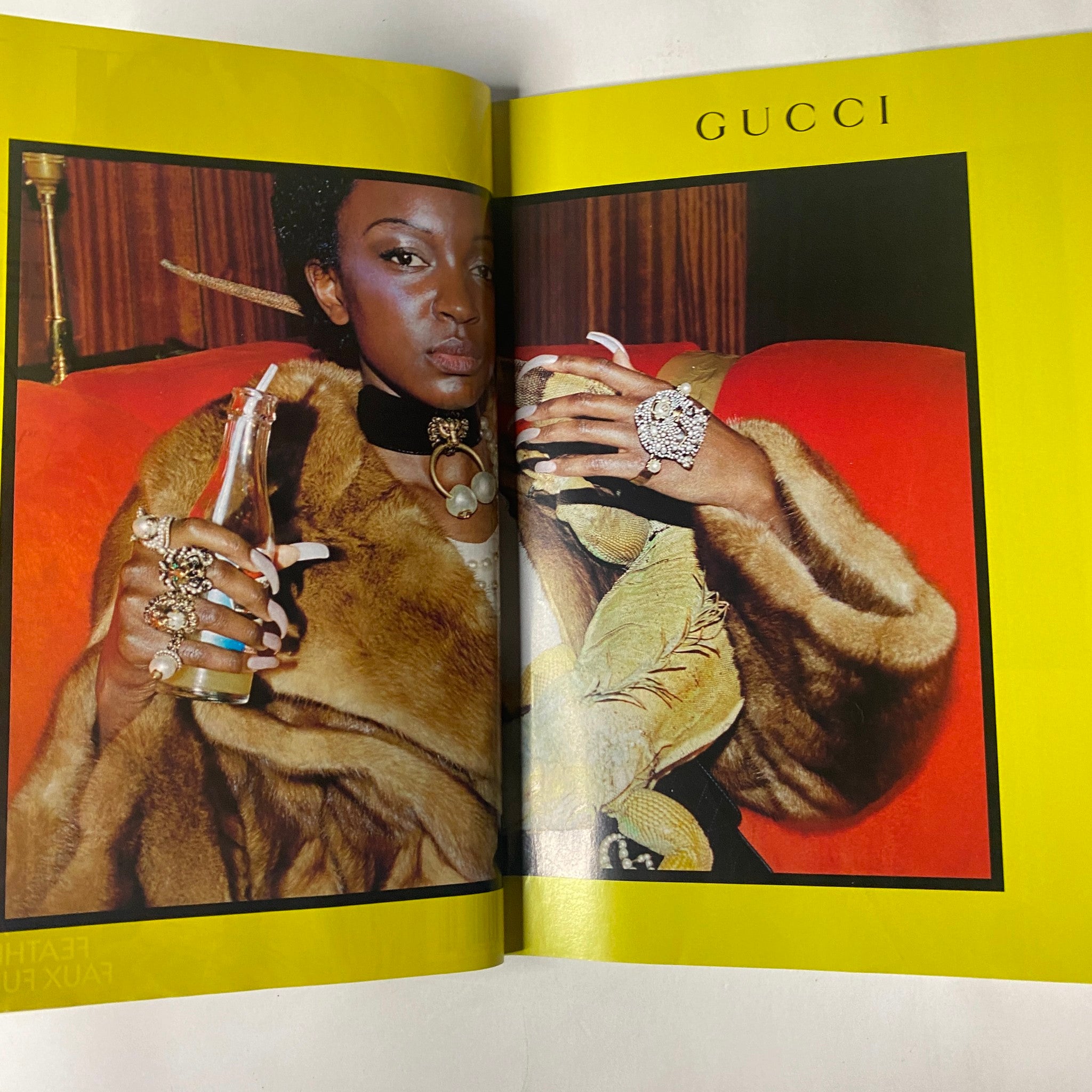 A bold fashion spread showcasing a model in luxurious fur holding a beverage, featured in Vogue Magazine July 2017, with a focus on Gucci fashion style.