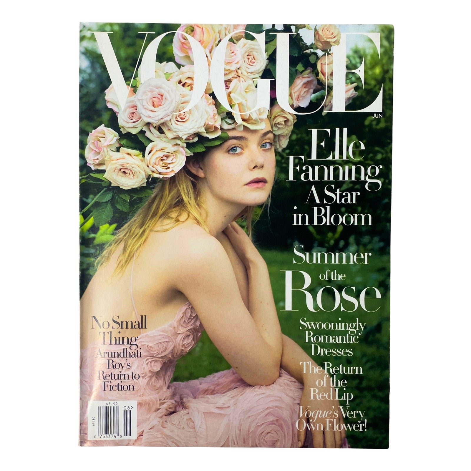 Vogue Magazine June 2017 featuring Elle Fanning on the cover with floral crown, emphasizing her status as a young Hollywood star. 'A Star in Bloom' highlights fashion and culture.