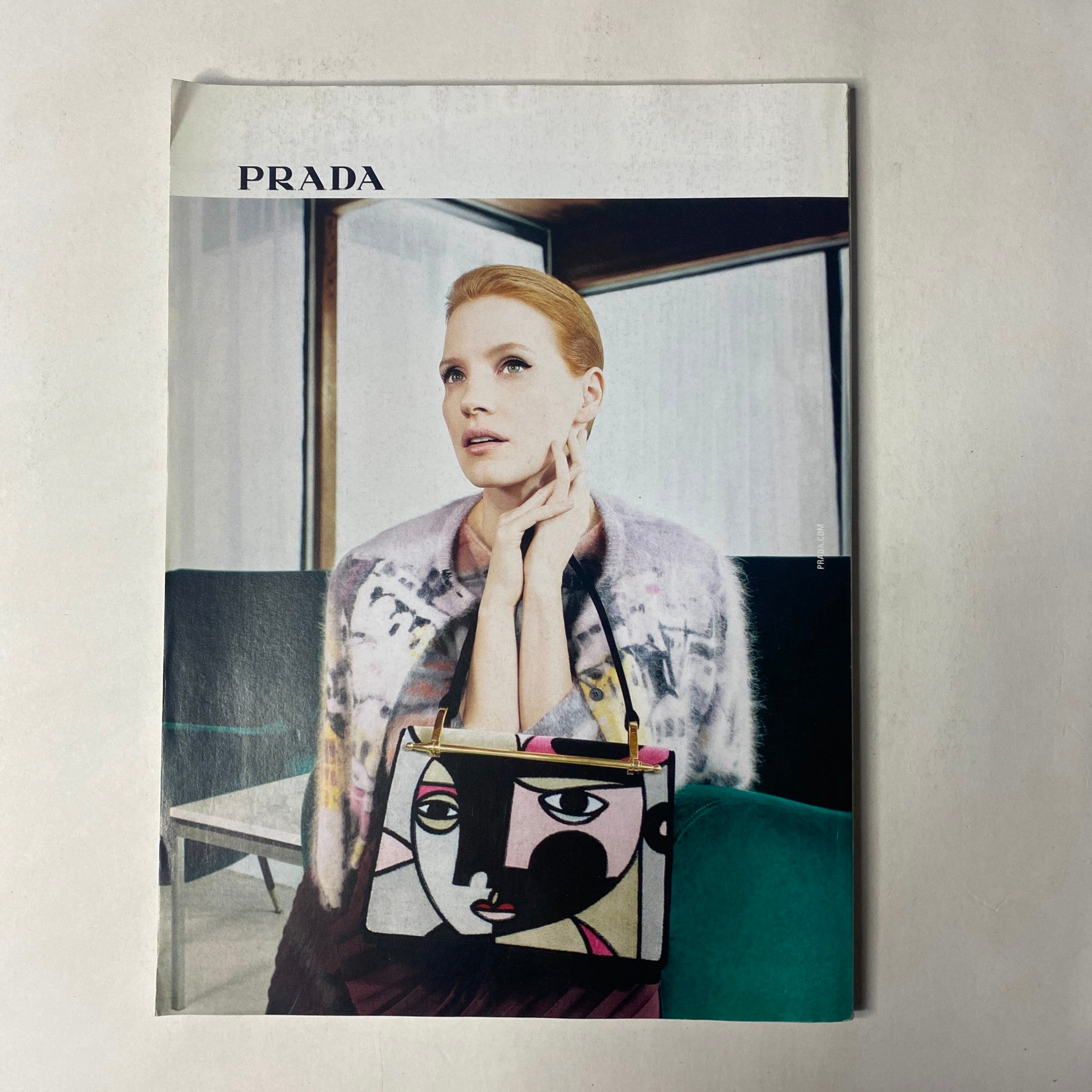 Prada advertisement page from Vogue Magazine June 2017, featuring a model showcasing a unique bag design, complementing the vibrant fashion themes of the issue.