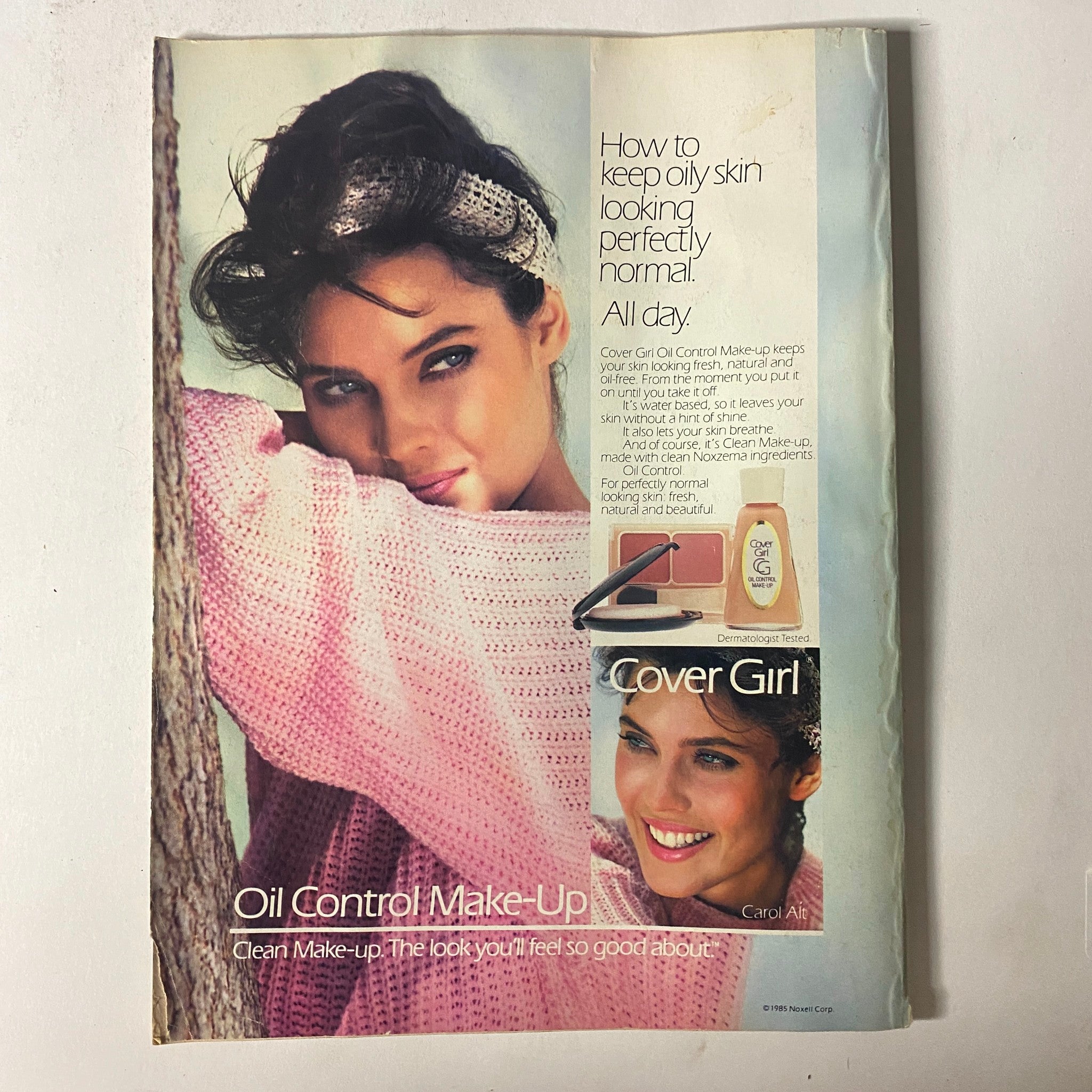 Cover Girl advertisement featuring a model with oily skin makeup tips, showcasing the product and a fashionable pink sweater. From Seventeen Magazine February 1986 The Romance of a Lifetime No Label VG.