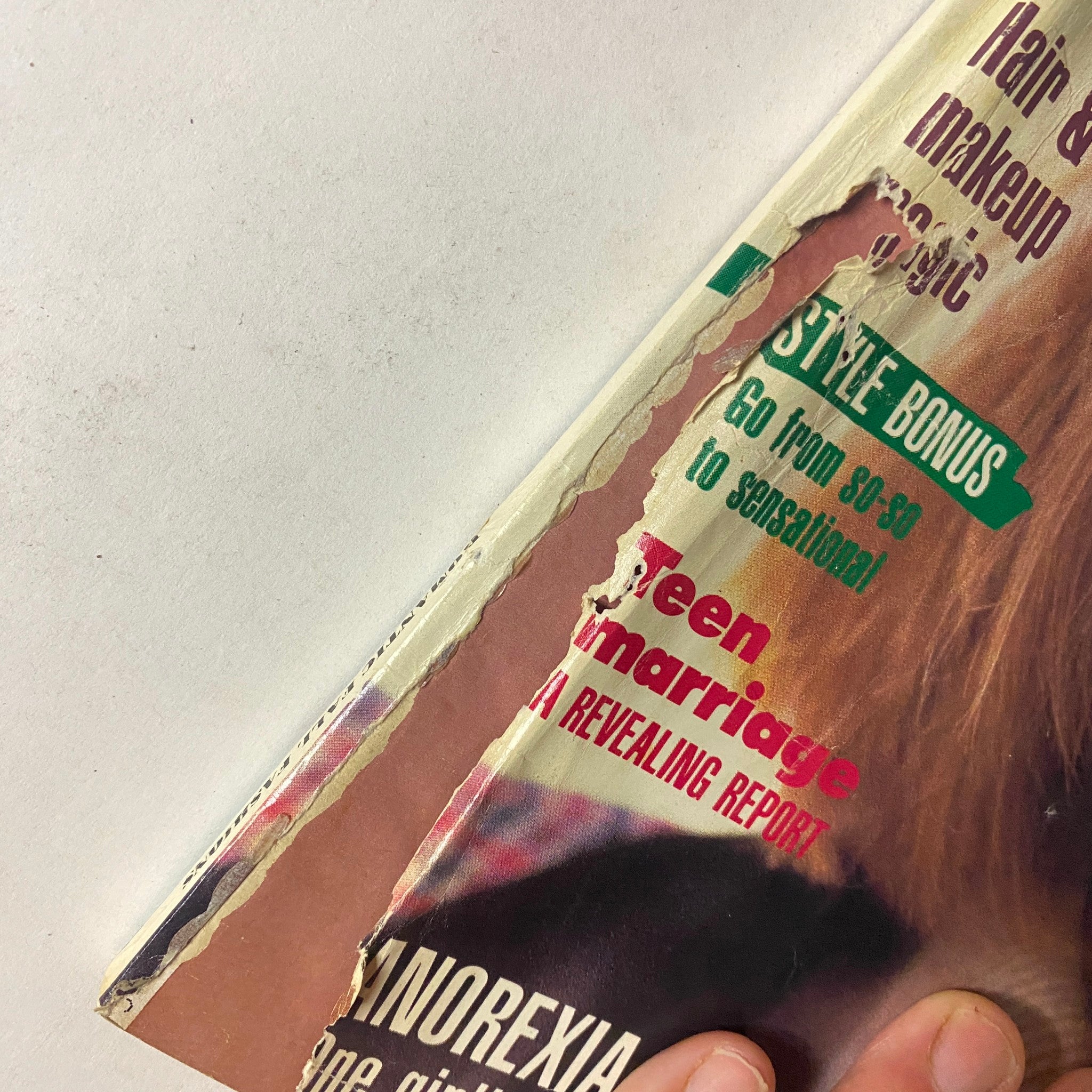 Close-up view of the edge of Seventeen Magazine September 1986, showing wear and tear, highlighting the vintage condition of the magazine.