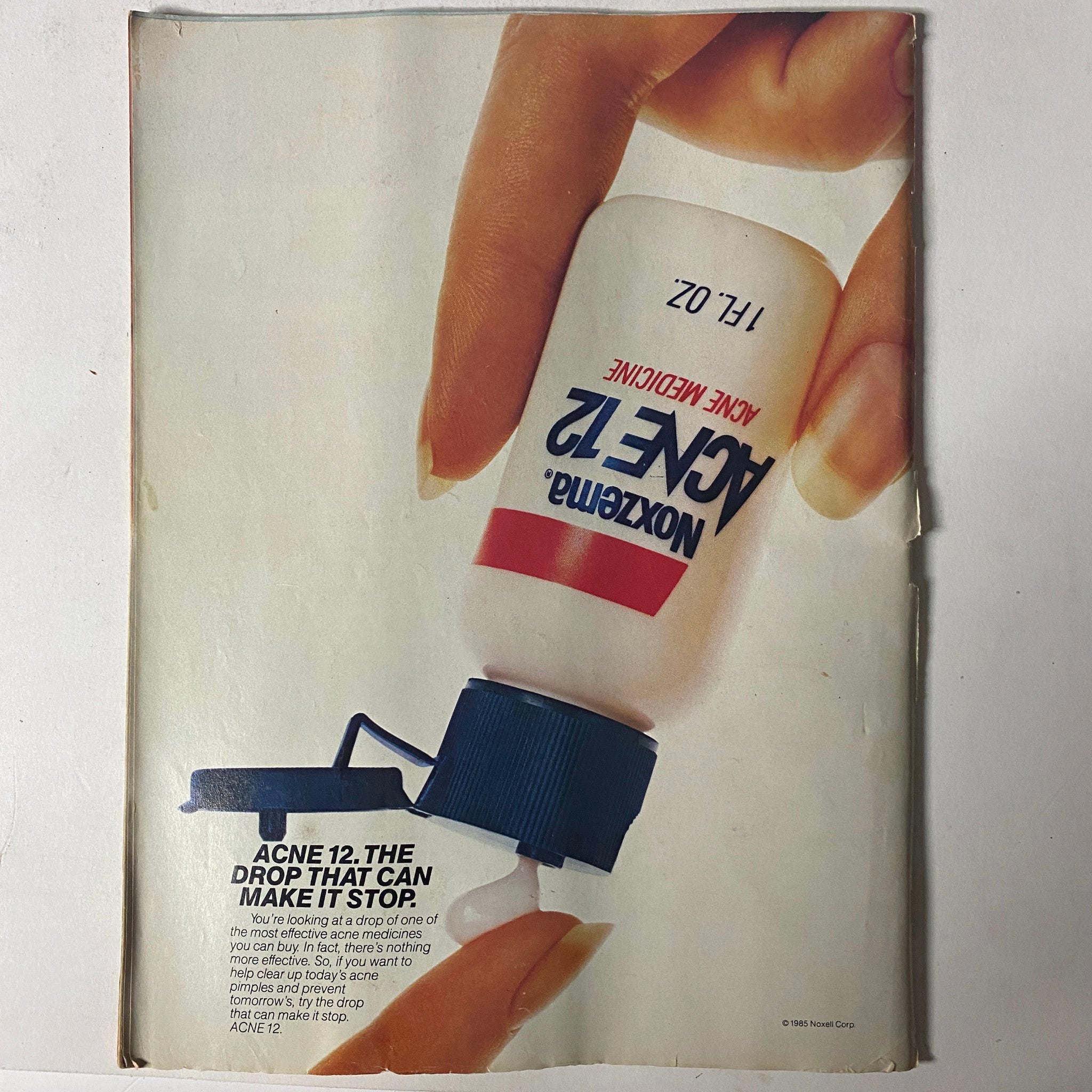 'Teen Magazine December 1985 back cover displaying an advertisement for Noxzema Acne Treatment, focusing on skincare solutions for teens.