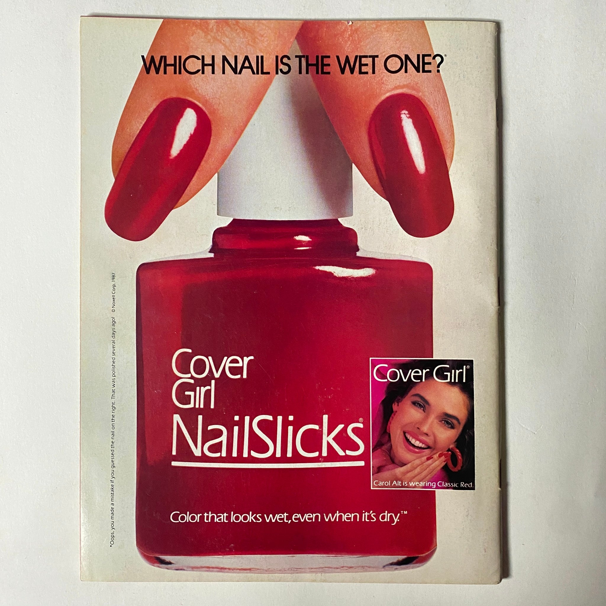 Cover Girl NailSlicks advertisement from January 1987 Teen Magazine showcasing vibrant red nail polish and a model with glossy nails, emphasizing color quality.