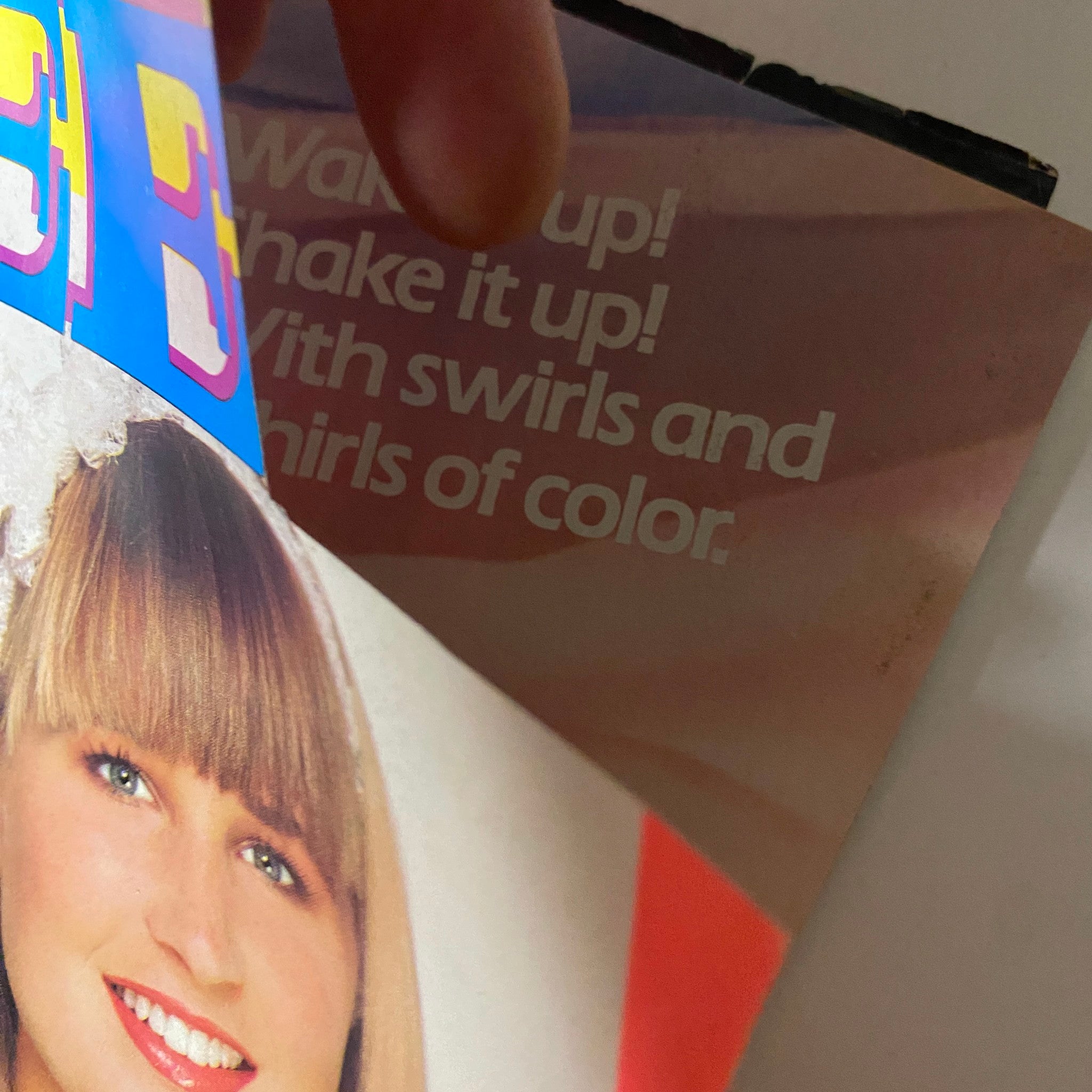 Close-up of the Teen Magazine February 1987 cover showcasing a smiling model with a stylish hairdo, emphasizing vibrant colors and beauty articles.