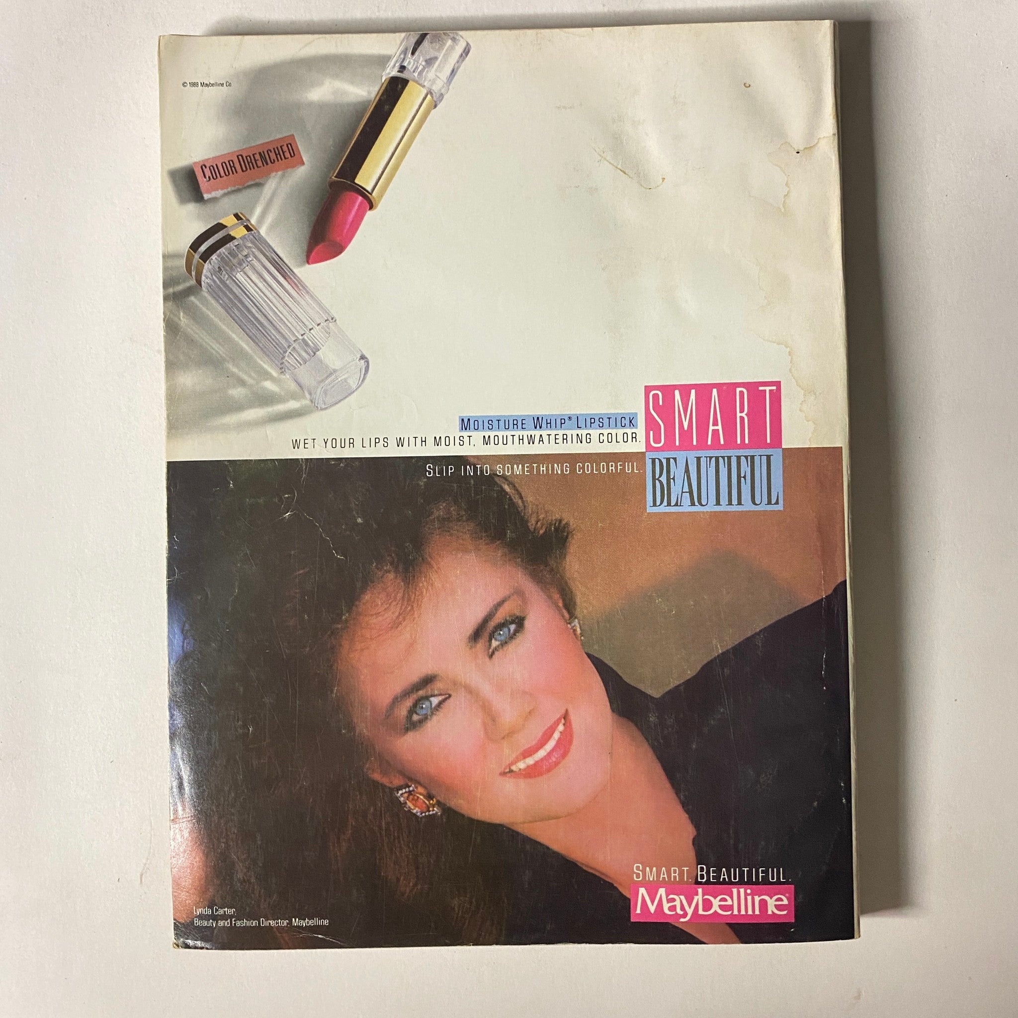 Seventeen Magazine August 1988 advertisement for Maybelline Smart Beautiful lipstick, showcasing a model with a vibrant lip color, emphasizing beauty products from the late 1980s.