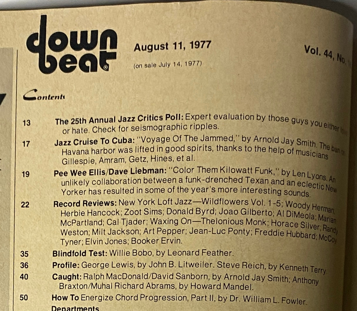 Table of contents for Down Beat Magazine August 11, 1977, detailing features on the Jazz Critics Poll, profiles on musicians, and record reviews.