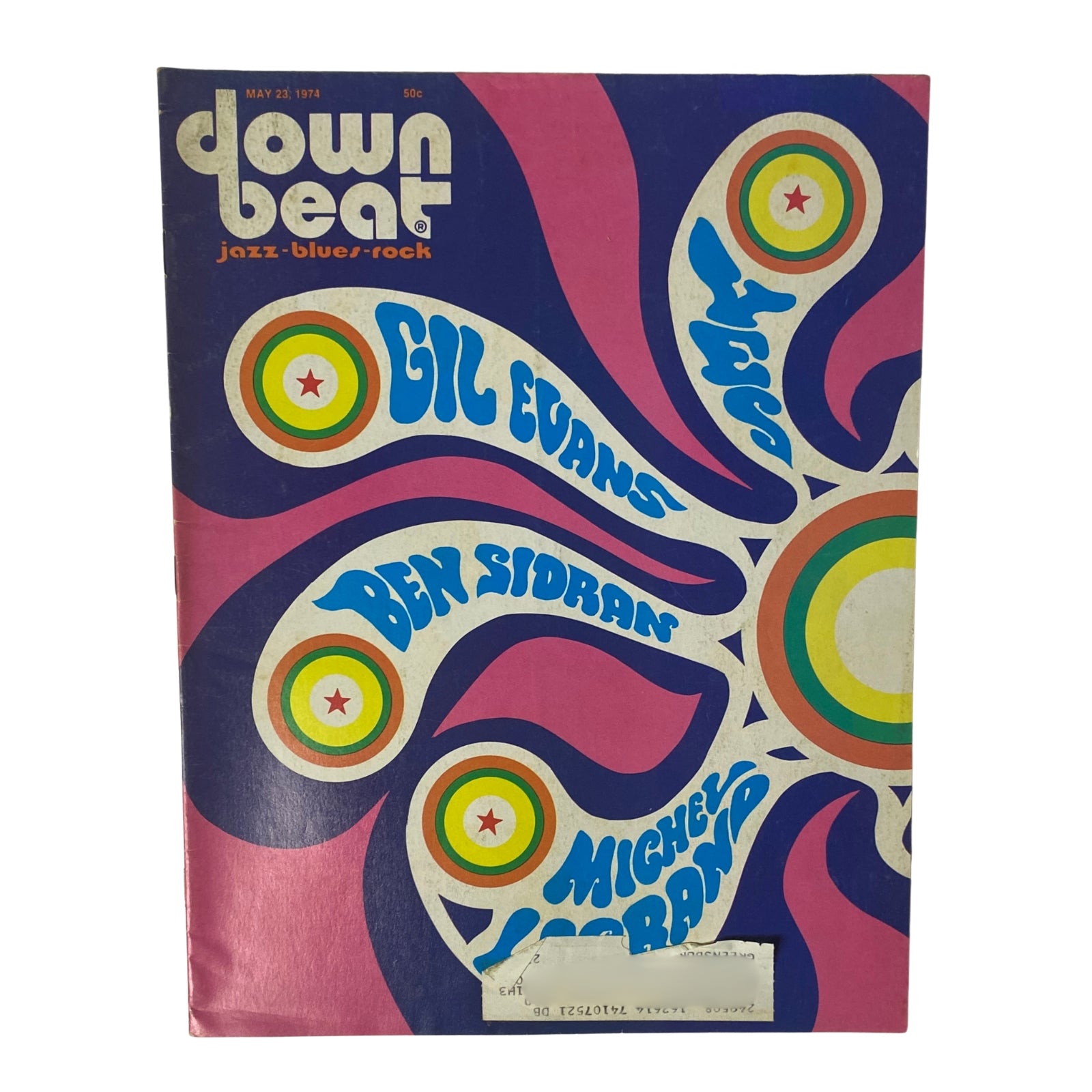 Cover of Down Beat Magazine from May 23, 1974, Volume 41, Number 10 featuring Gil Evans, Ben Sidran, and Michel Legrand. The colorful design showcases a psychedelic art style with vibrant swirls and bold typography.