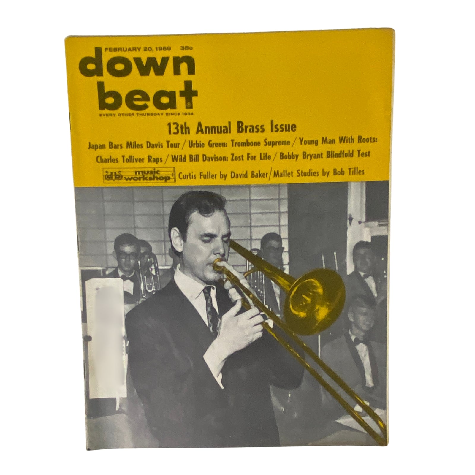 Cover of Down Beat Magazine, February 20, 1969 featuring trombonist Urbie Green and trumpet player Charles Tolliver, showcasing the 13th Annual Brass Issue.
