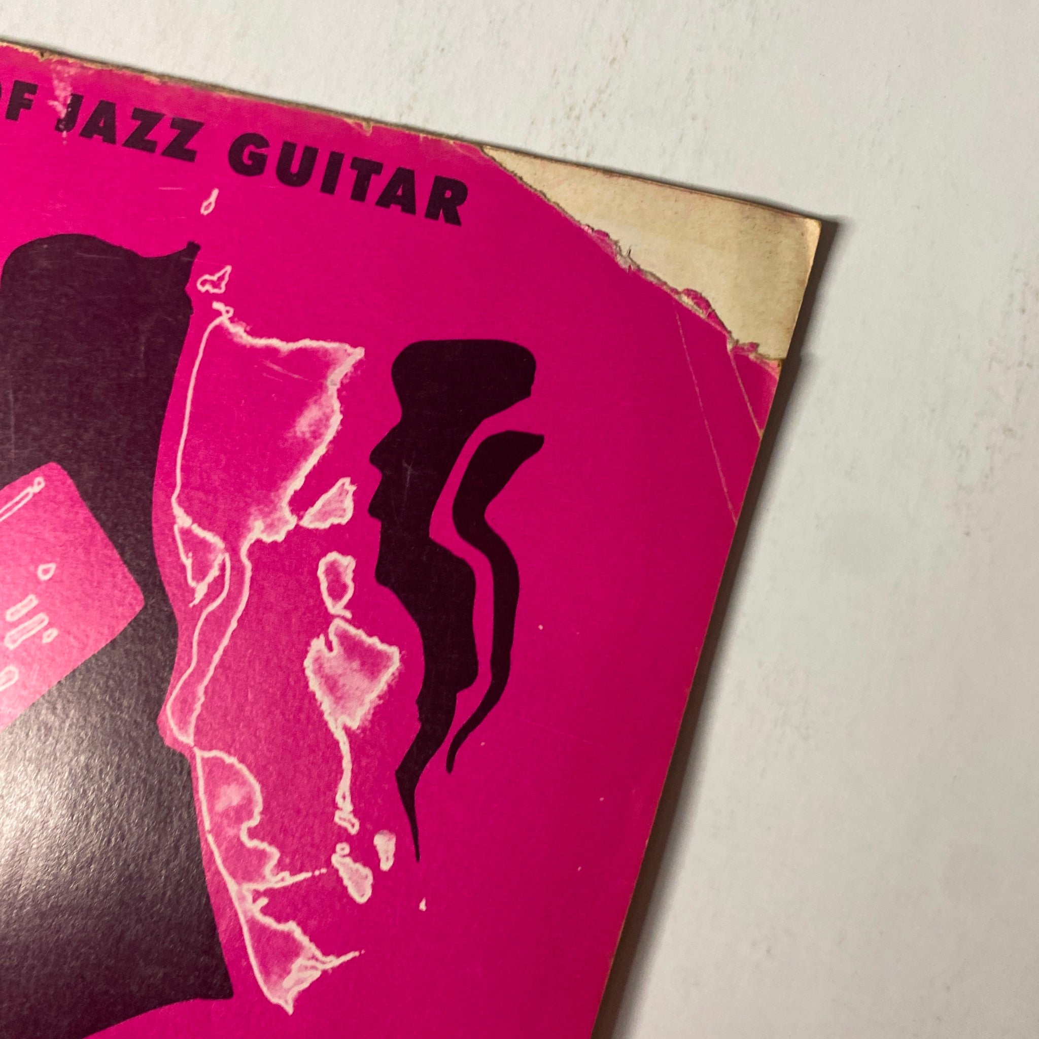 Cover corner of Down Beat Magazine June 10, 1971 Vol 38 No. 12 featuring vibrant pink design and elements representing jazz guitar.