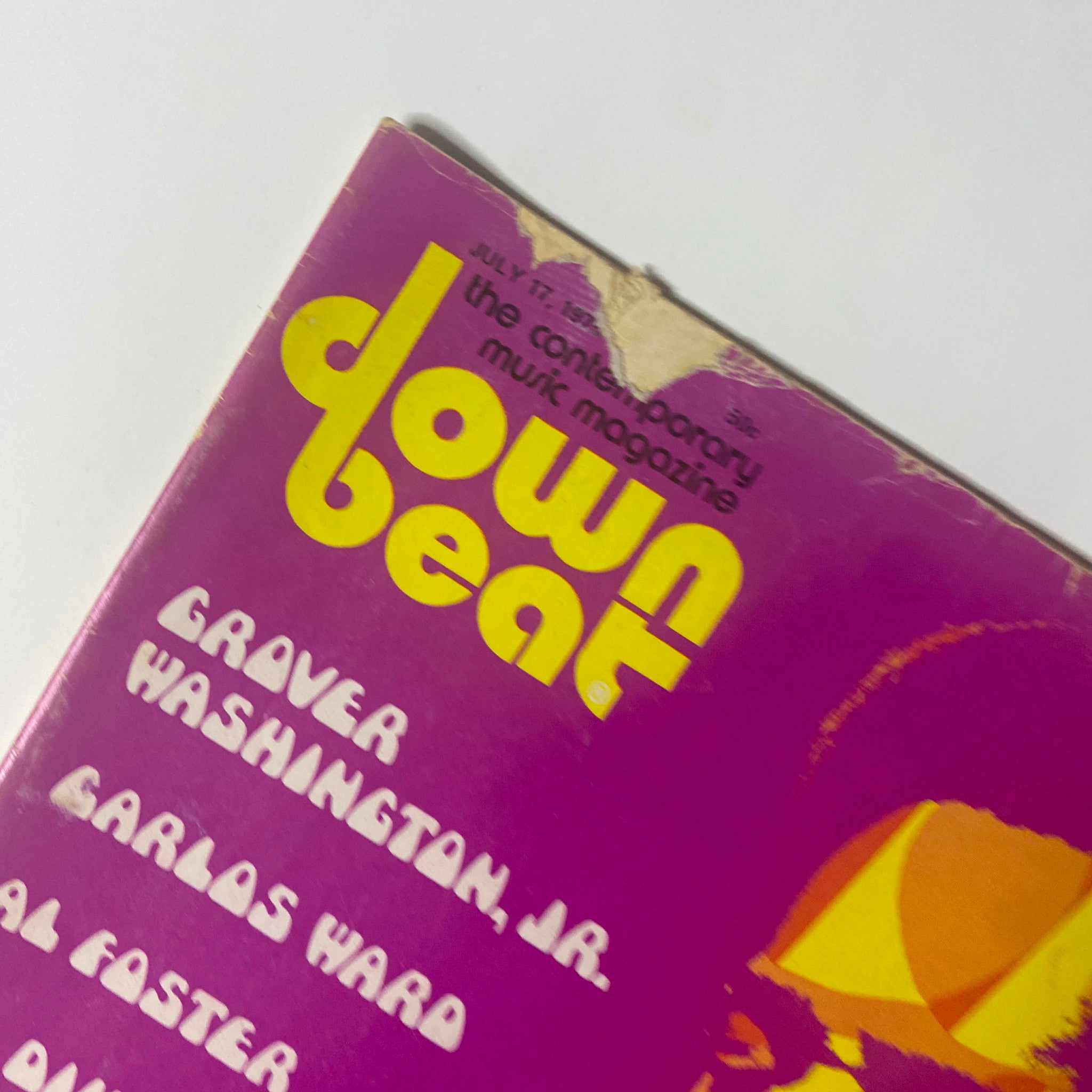Close-up view of the Down Beat Magazine logo on the July 17, 1975 issue, emphasizing its vintage design and notable artists featured including Grover Washington Jr.