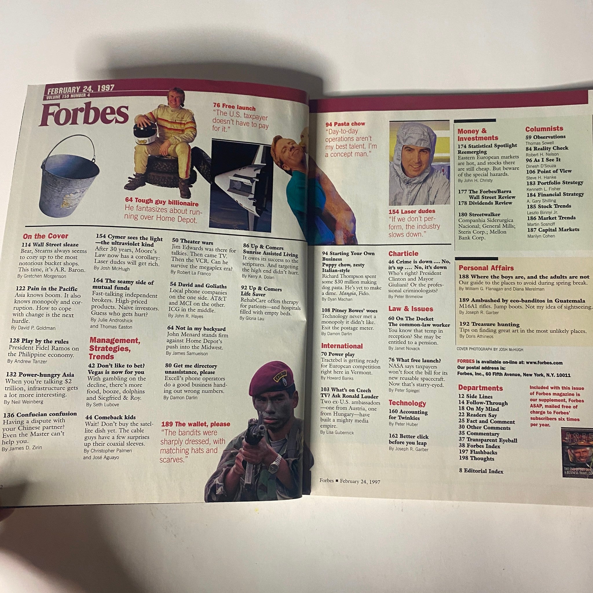 Inside spread of Forbes Magazine dated February 24, 1997, highlighting articles and features, including 'Wall Street Sleaze.' The layout includes a detailed table of contents alongside visual elements from the magazine.