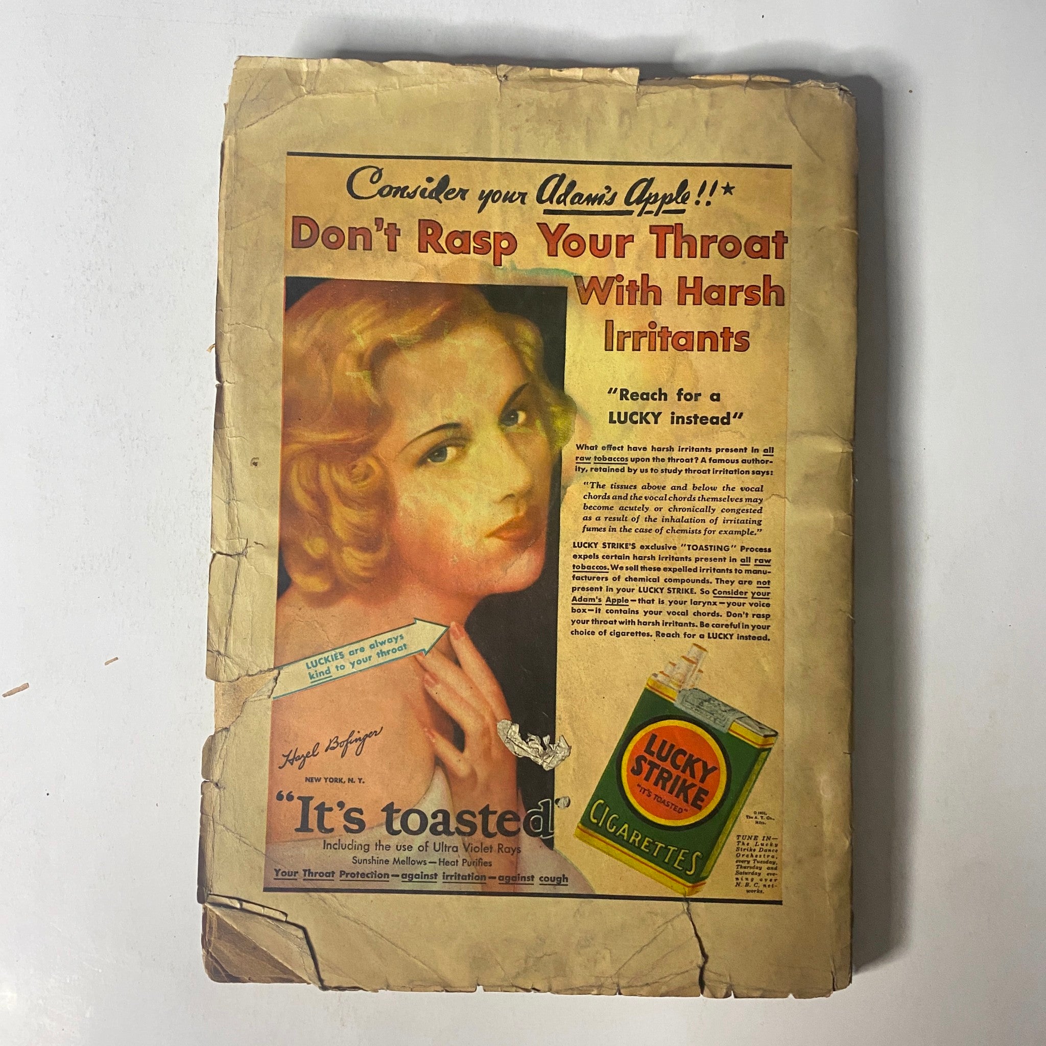 Back cover of The Popular Magazine September 1931 displaying an advertisement for Lucky Strike cigarettes, featuring a vintage illustration of a blonde woman, highlighting retro advertising style.