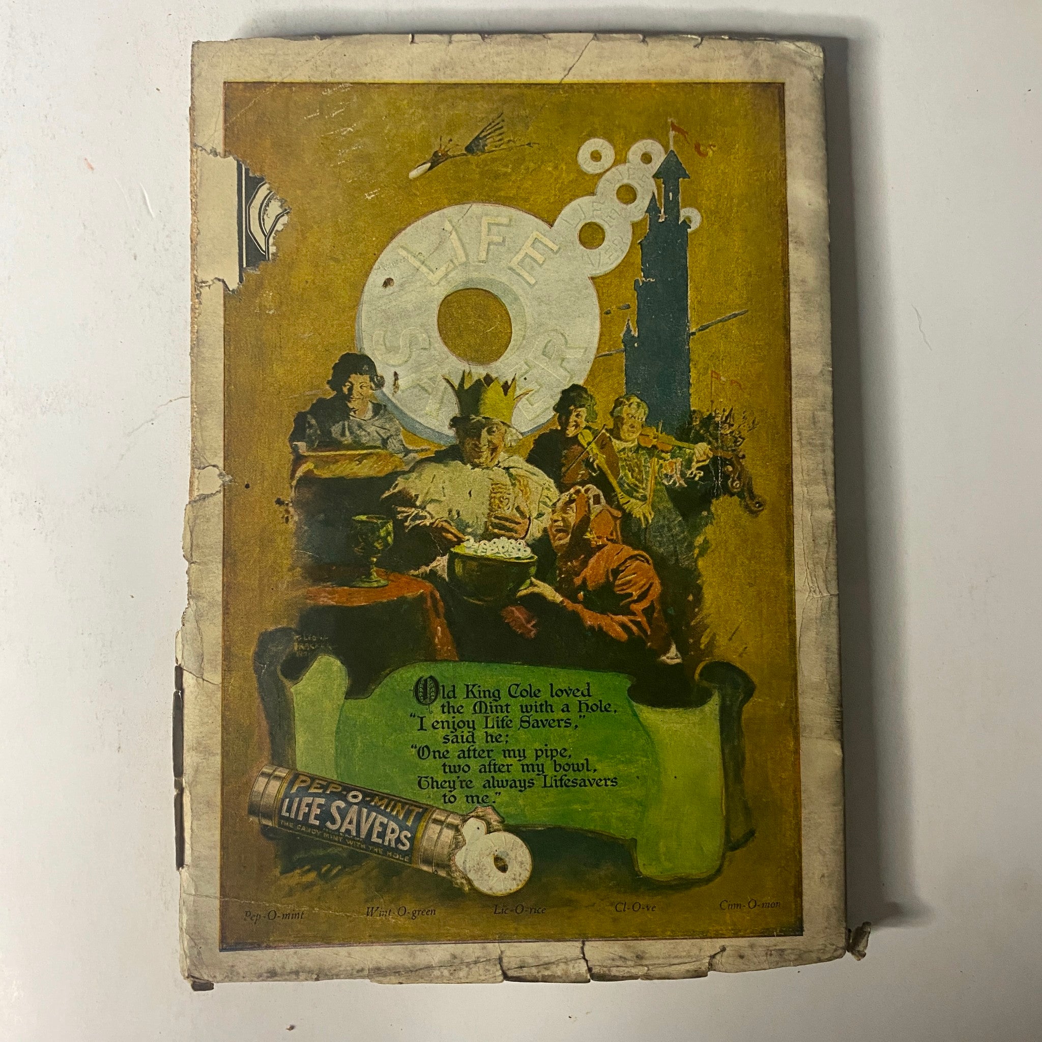 Back cover of The Popular Magazine April 7, 1922 illustrating an advertisement for Life Savers, featuring a whimsical scene with characters enjoying treats, reflecting the vintage advertising style of the era.