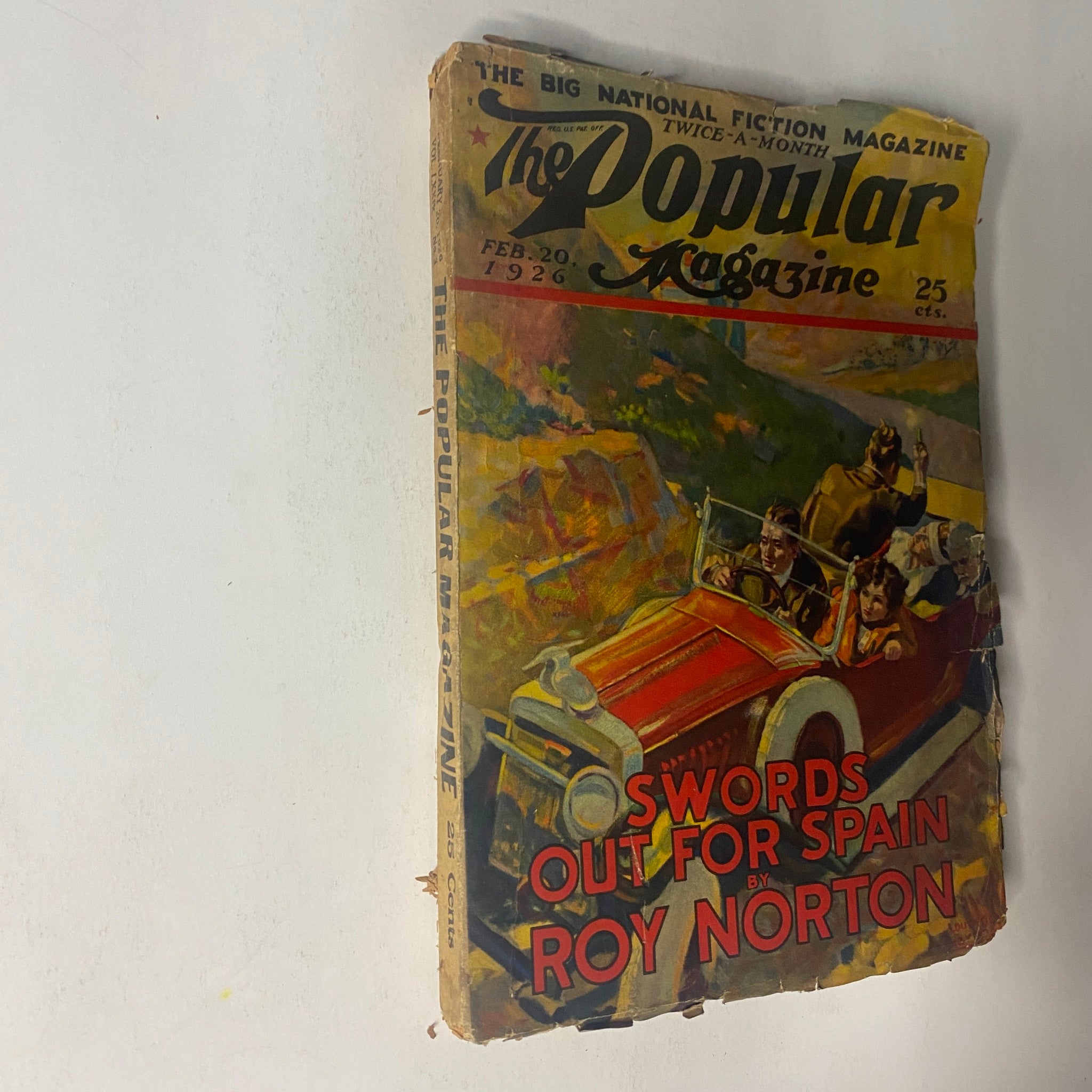 Another angle of the cover of The Popular Magazine, February 20, 1926, with 'Swords Out for Spain' by Roy Norton prominently displayed, showcasing the illustration of a vintage car.