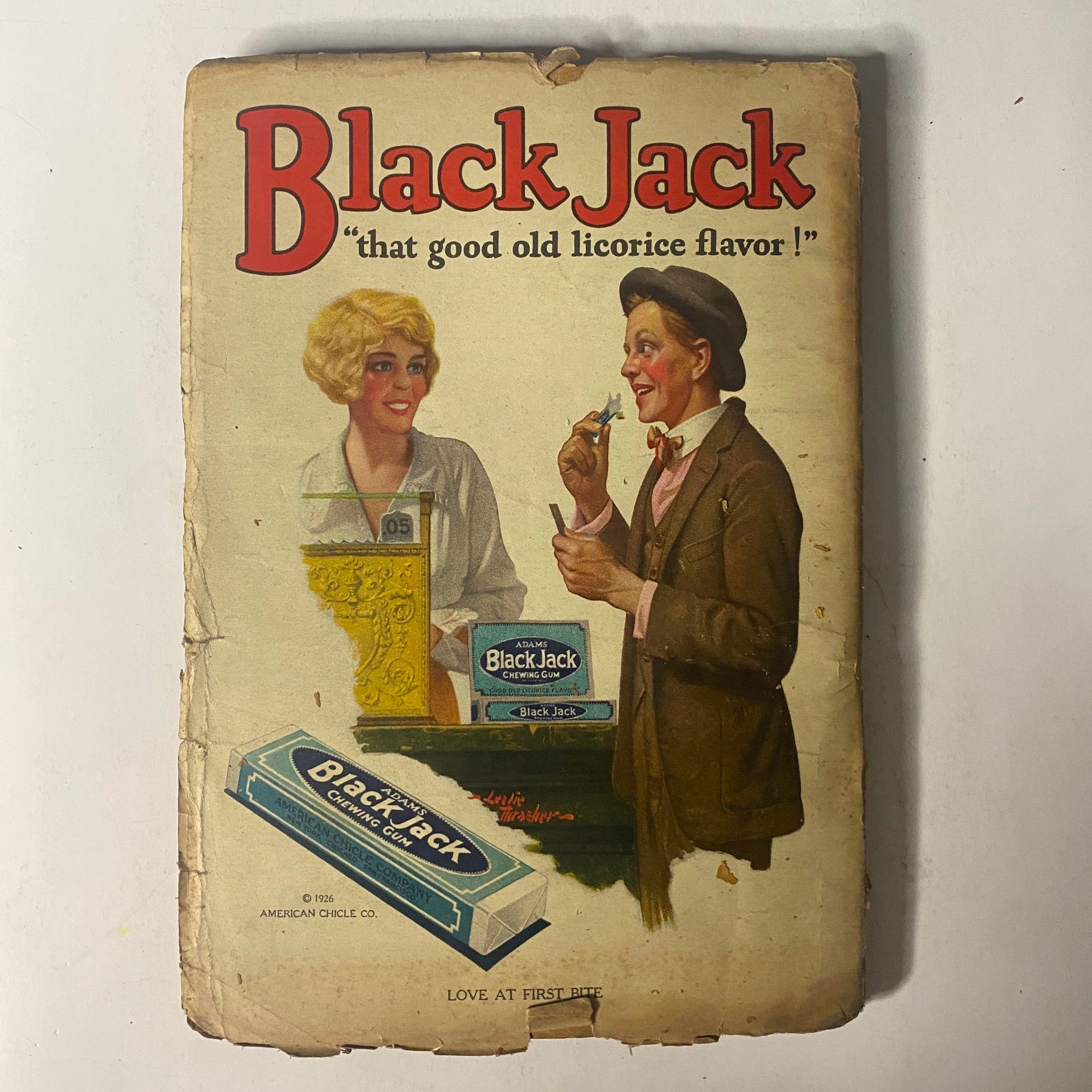 Back cover of a vintage advertisement for Black Jack licorice, featuring a woman and a man, providing a nostalgic glimpse of early 20th-century advertising.