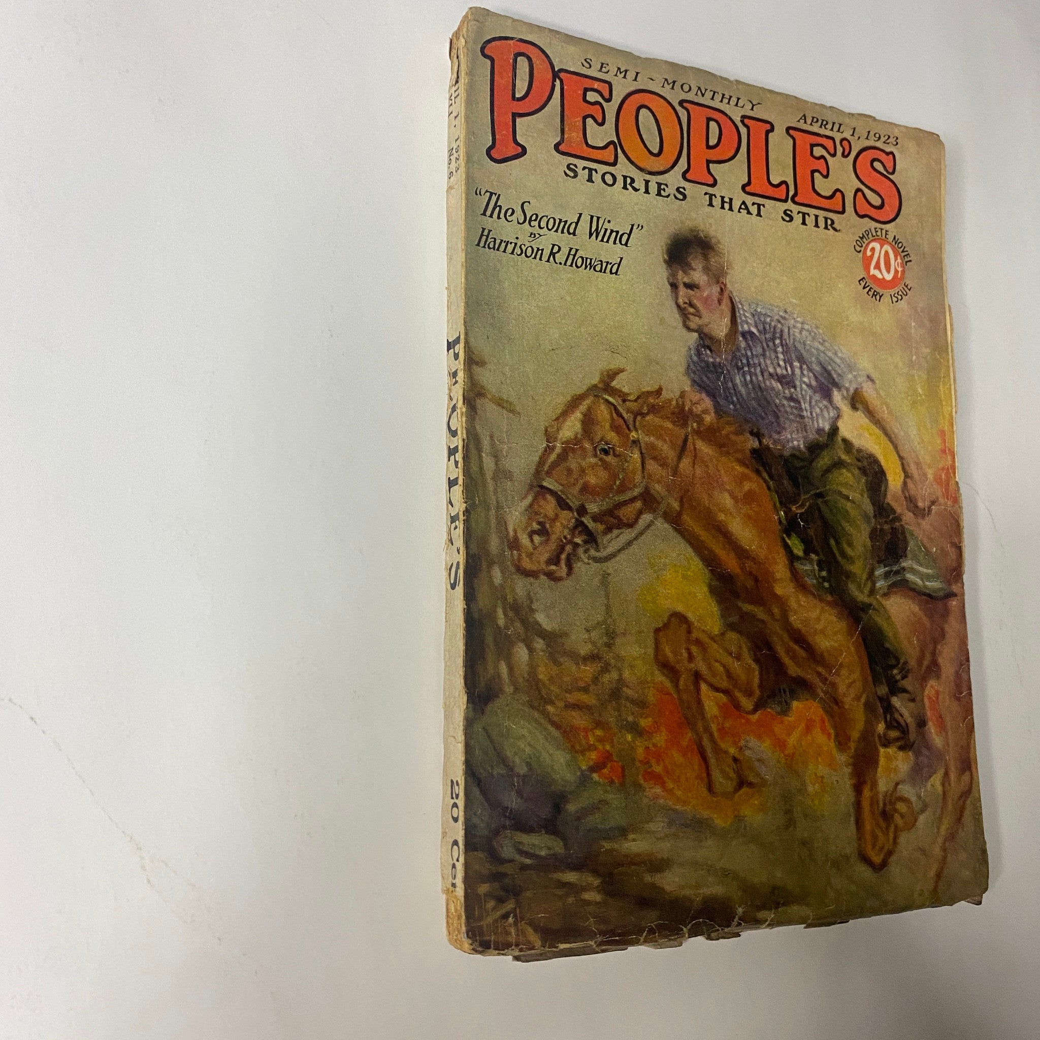 People's Magazine, April 1, 1923, showcasing the cover artwork of 'The Second Wind' by Harrison R. Howard, with a horse rider in action.
