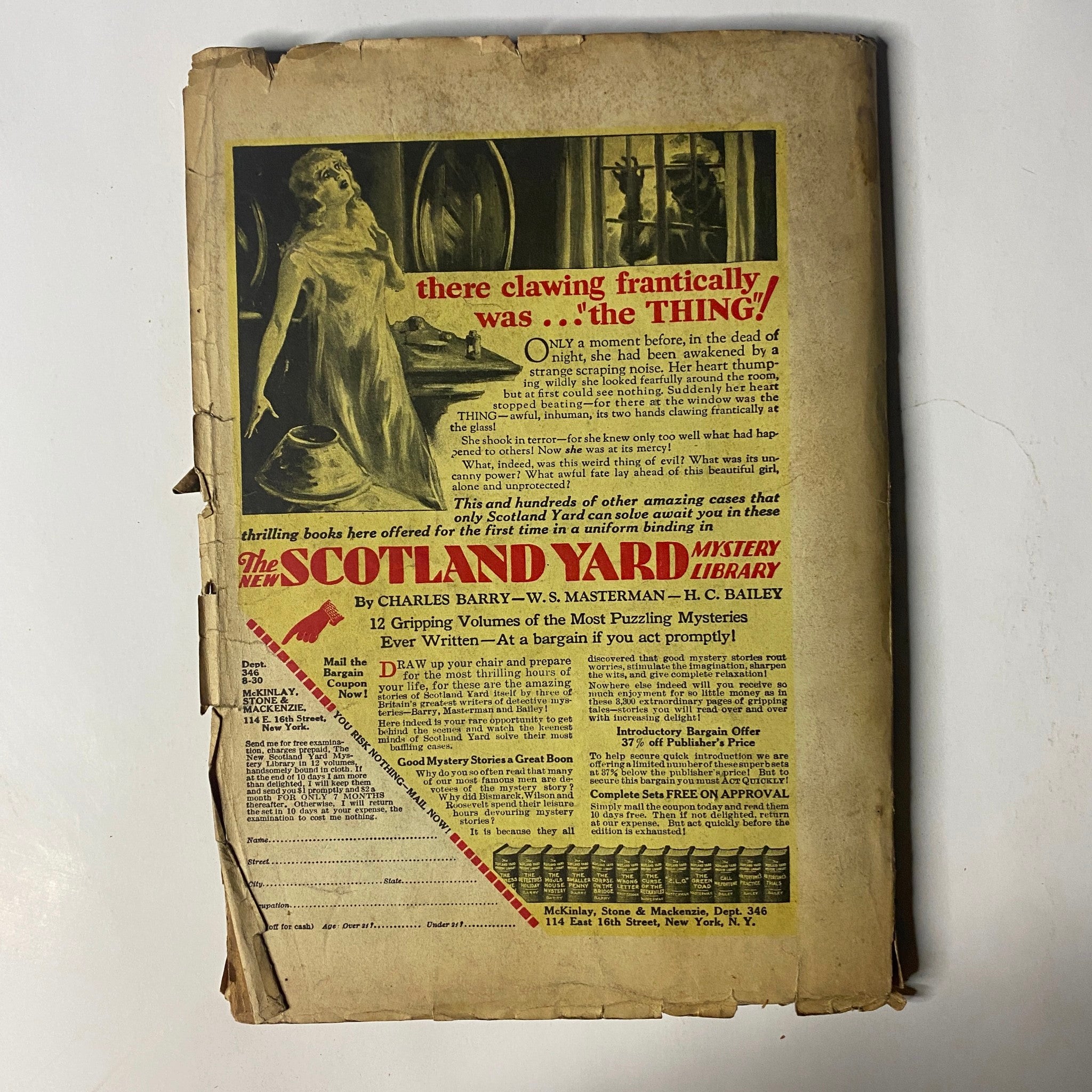 Back cover of The Popular Magazine August 2, 1930, promoting the Scotland Yard Mystery Library with an intriguing horror-themed advertisement.