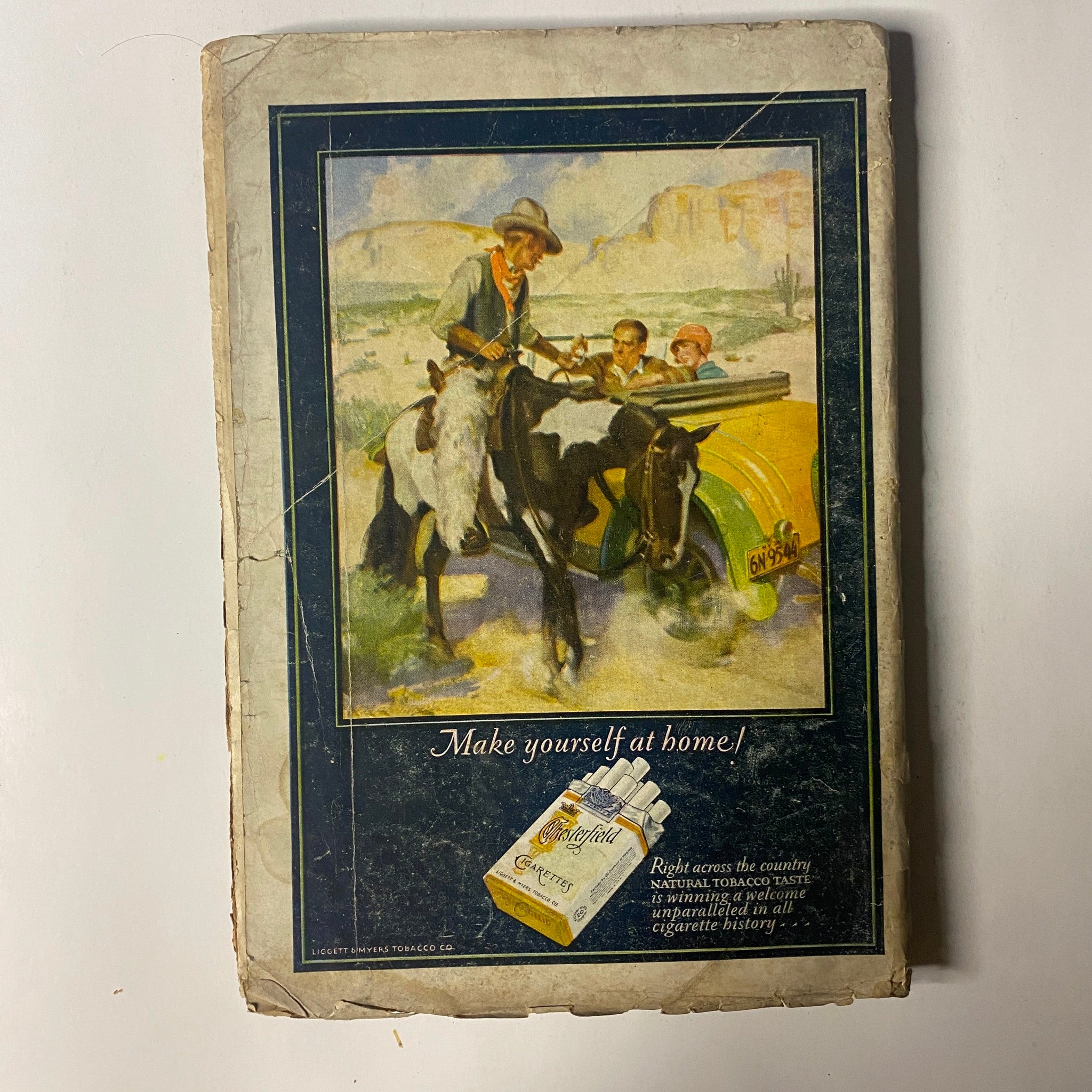 The Popular Magazine October 1, 1927 Gun Smoke - Back cover advertisement featuring a cowboy and children with a tagline 'Make yourself at home!', emphasizing the nostalgic design of this vintage pulp magazine.