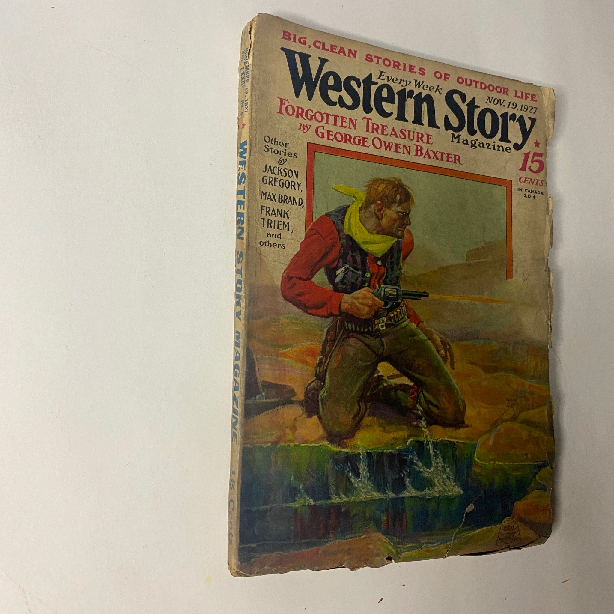 Cover of Western Story Magazine, November 19, 1927, featuring the novelette 'Forgotten Treasure' by George Owen Baxter with a cowboy illustration.