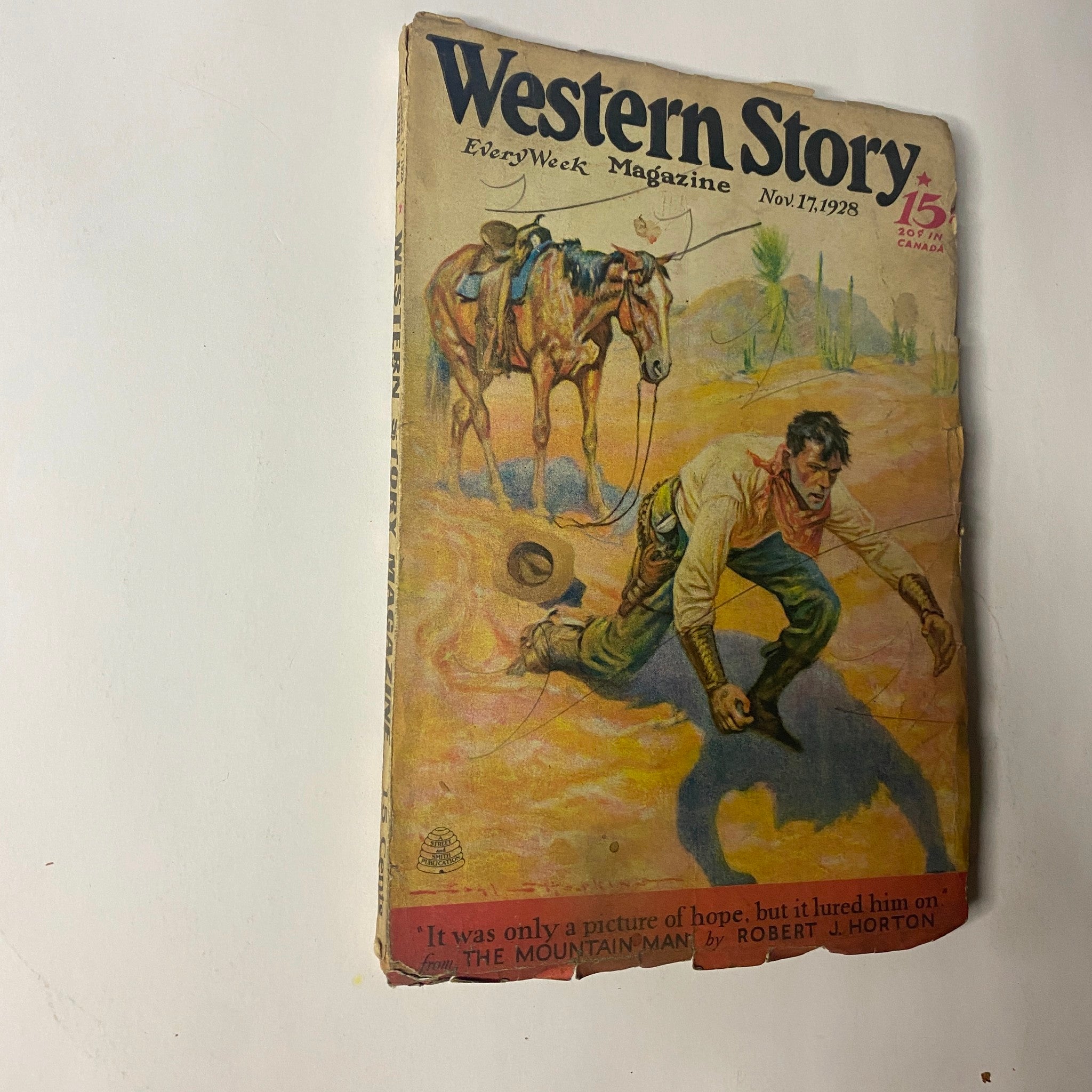 Cover of Western Story Magazine, November 17, 1928, featuring an illustration of a rugged man and a horse in a Western setting, highlighting the full-length novel 'The Mountain Man' by Robert J. Horton.