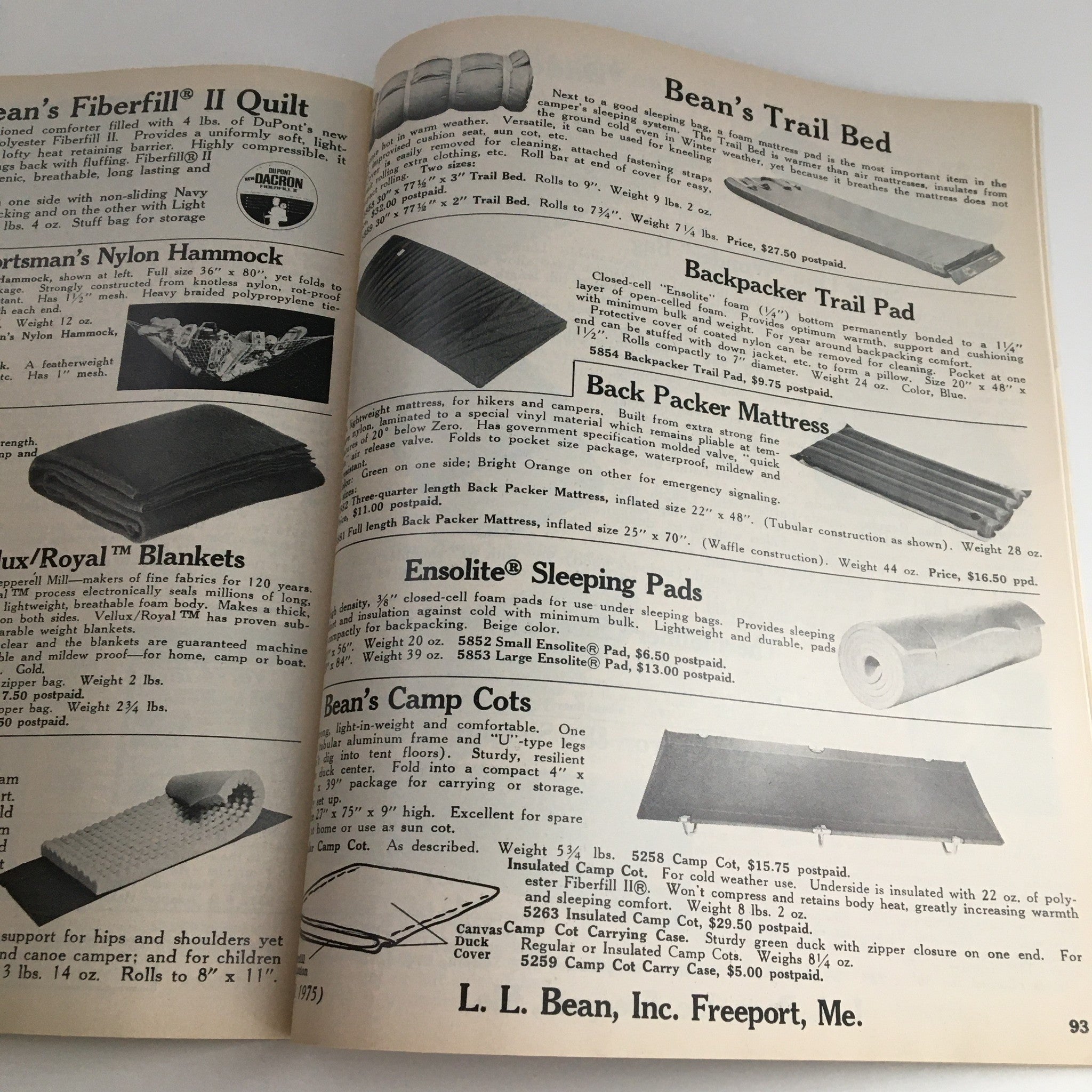 Page from the 1975 Fall L.L. Bean Retail Company, Inc. Price Guide Catalog showcasing outdoor gear including 'Bean’s Trail Bed', 'Backpacker Trail Pad', and 'Ensolite Sleeping Pads', with pricing and descriptions.