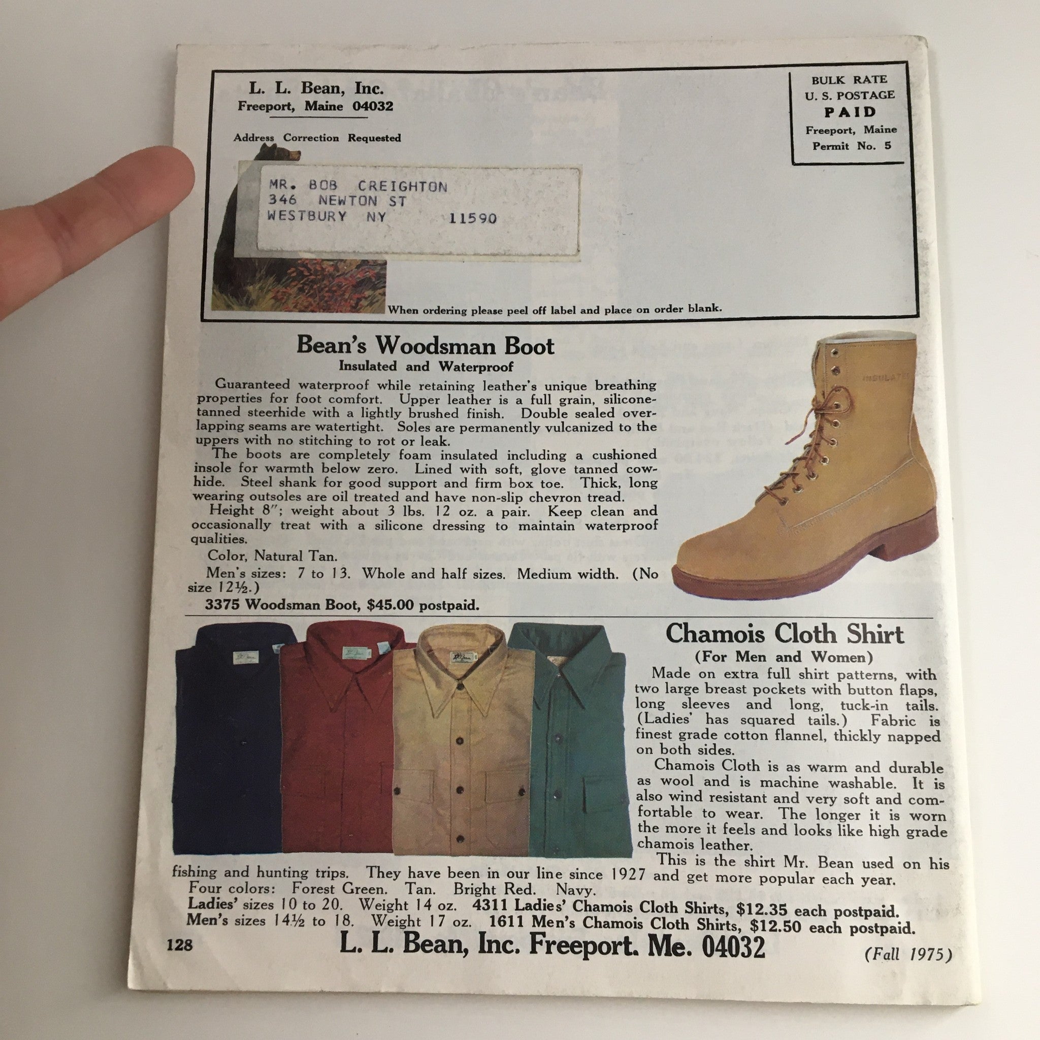 Back cover of the 1975 Fall L.L. Bean Retail Company, Inc. Price Guide Catalog featuring the 'Beans Woodsman Boot', 'Chamois Cloth Shirt', and pricing information, alongside an address label for authenticity.