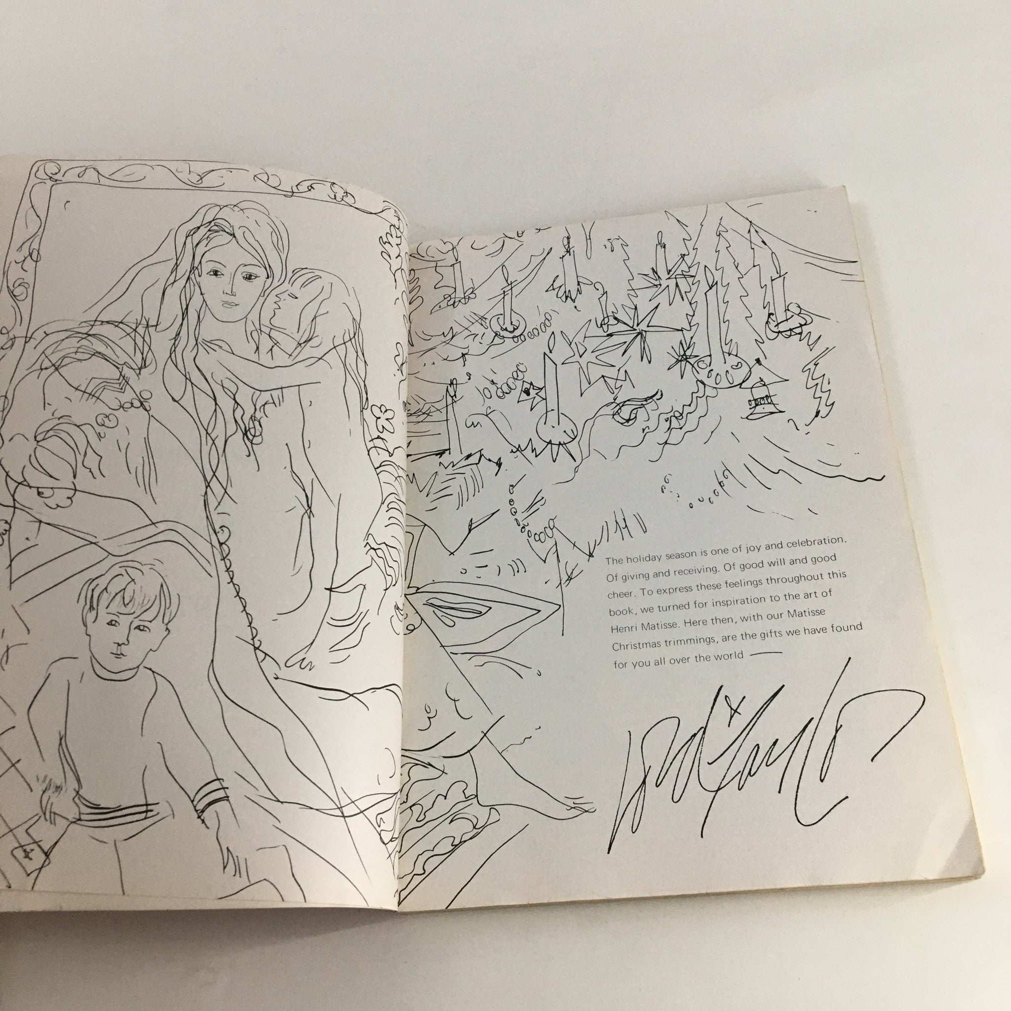 Illustrated page inside the 1970 The Lord and Taylor Christmas Book, depicting a festive scene and a signature.