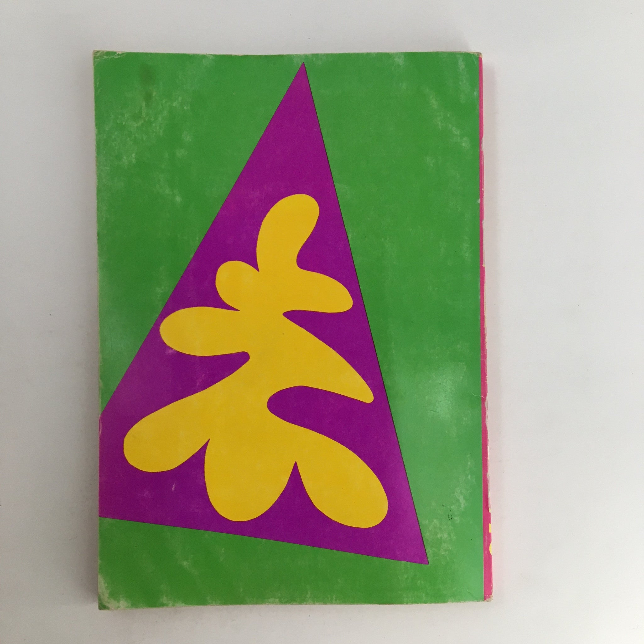 Cover design of the 1970 The Lord and Taylor Christmas Book featuring bold geometric patterns and bright colors for a festive look.