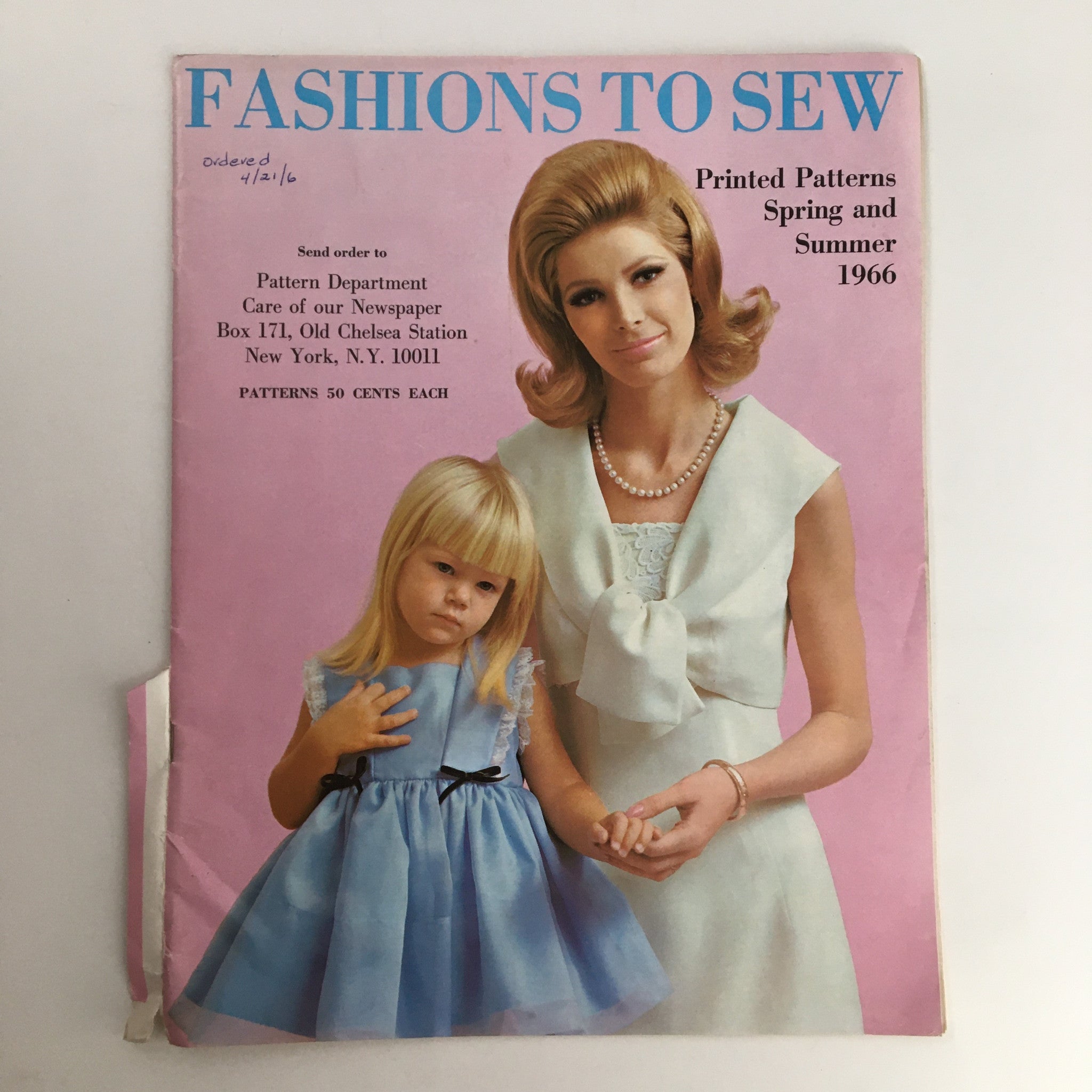Vintage magazine cover of 'Fashion To Sew Printed Patterns Spring and Summer 1966' featuring a woman in a white dress with a bow and a girl in a blue dress, set against a pink background, showcasing retro fashion from the 1960s.