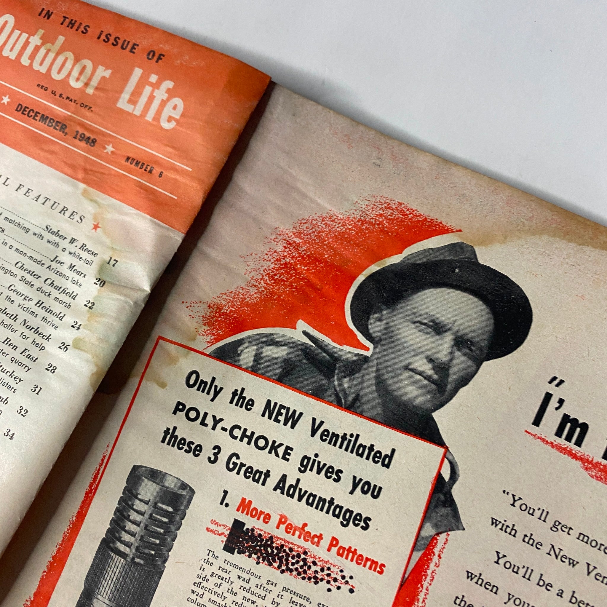Interior page of Outdoor Life Magazine December 1948 featuring an advertisement for Poly-Choke, with a smiling man wearing a hat. The page highlights three advantages of the new ventilated Poly-Choke.