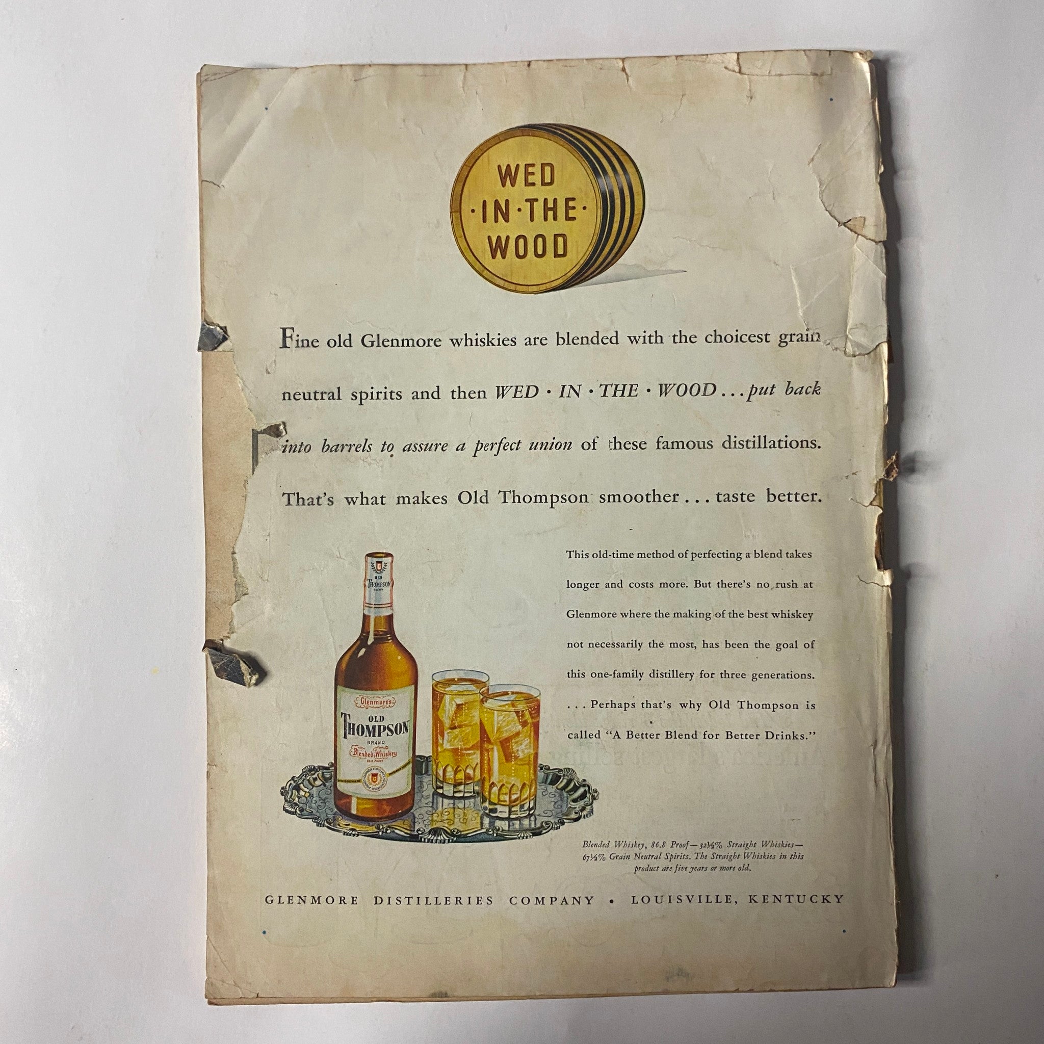 Back cover of Outdoor Life Magazine March 1947 displaying an advertisement for Wed In The Wood whiskies, featuring vintage graphics and text.