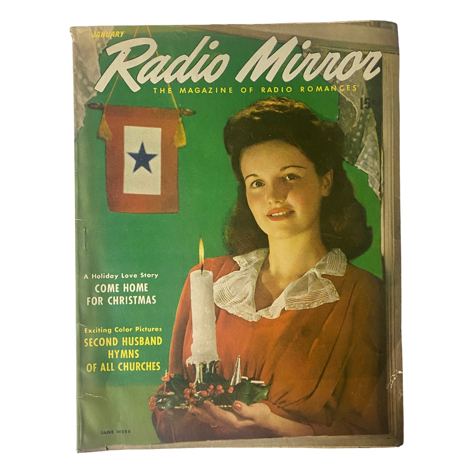 Radio Mirror Magazine January 1944 featuring Jane Webb on the cover, showcasing retro design with a festive candle decoration and Christmas theme.