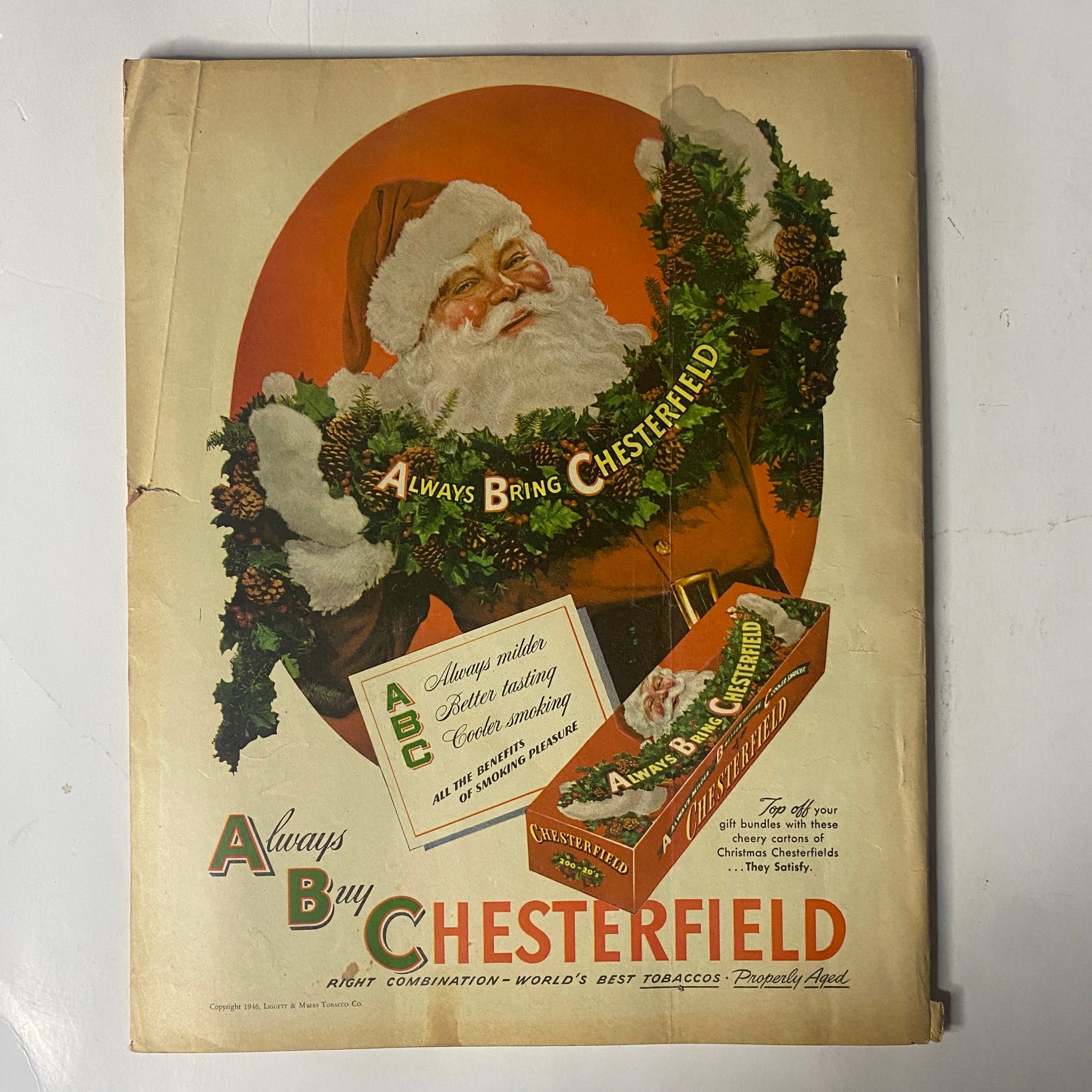 Advertisement featuring Santa Claus for Chesterfield cigarettes from Radio Mirror Magazine December 1946. The cover showcases festive imagery alongside promotional content for Chesterfield tobacco products.