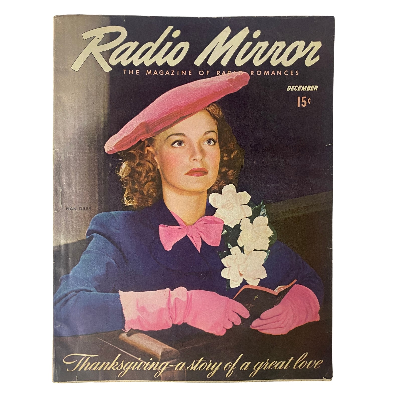 Radio Mirror Magazine December 1943 featuring a cover with a woman in a pink hat and gloves holding a bouquet, symbolizing romantic stories and holiday spirit, ideal for vintage magazine collectors.