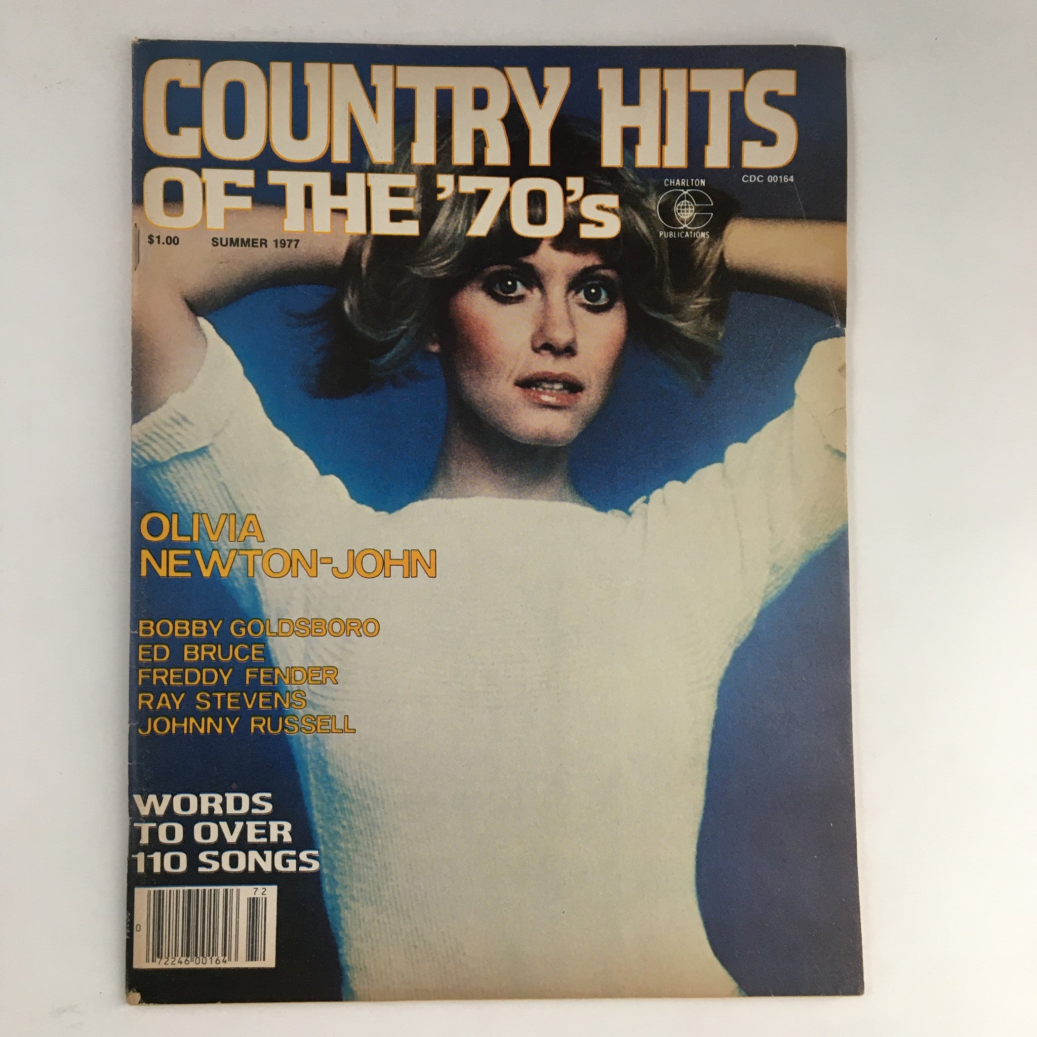 Cover of 'Country Hits of the Seventies Summer 1977' featuring Olivia Newton-John. The magazine showcases popular country artists and songs from the 1970s.