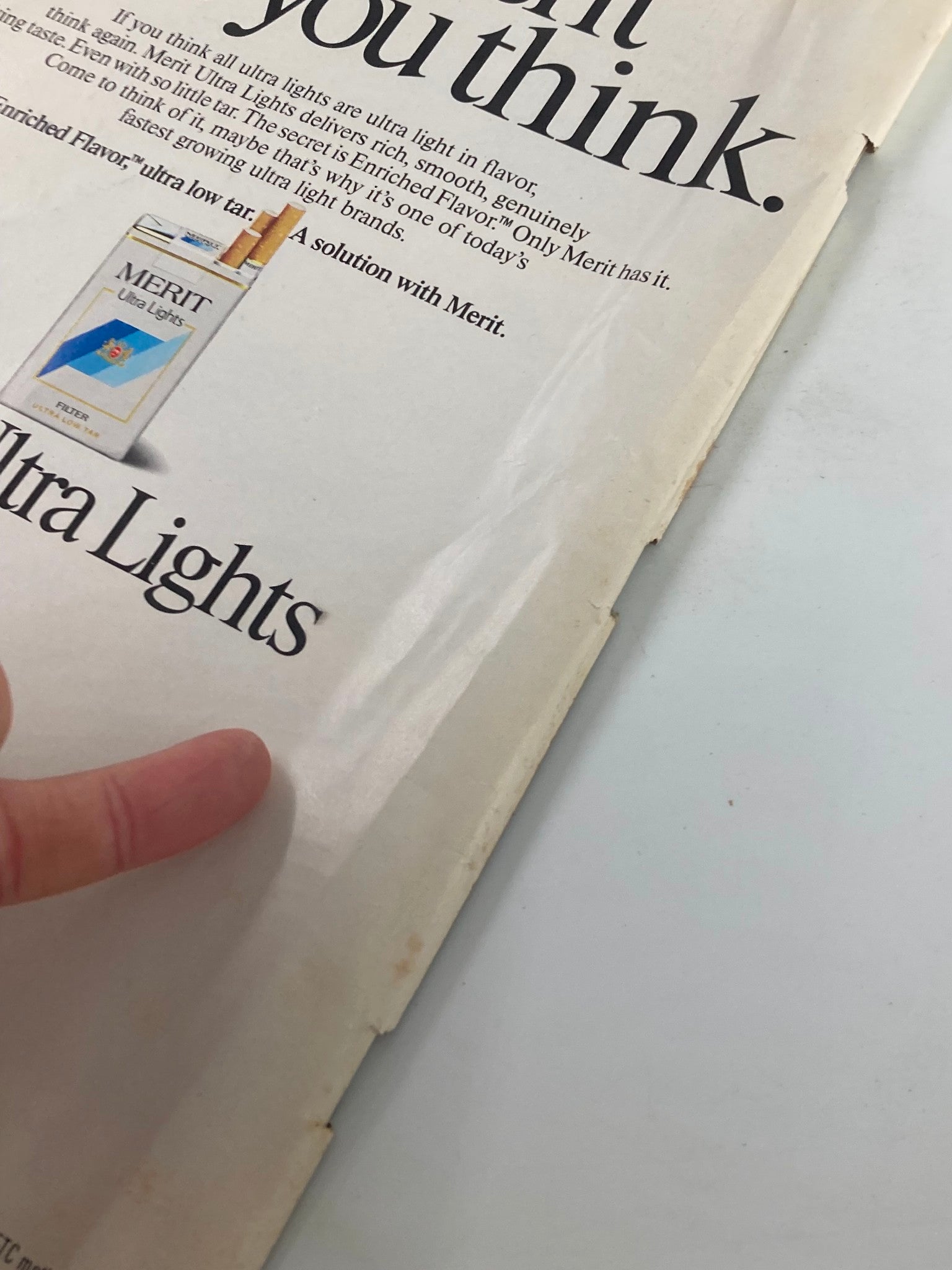 Close-up of a MERIT Ultra Lights advertisement featured in the VTG People Weekly Magazine October 10 1988, showcasing cigarette branding with the text 'If you think all ultra lights are ultra light in flavor...'.