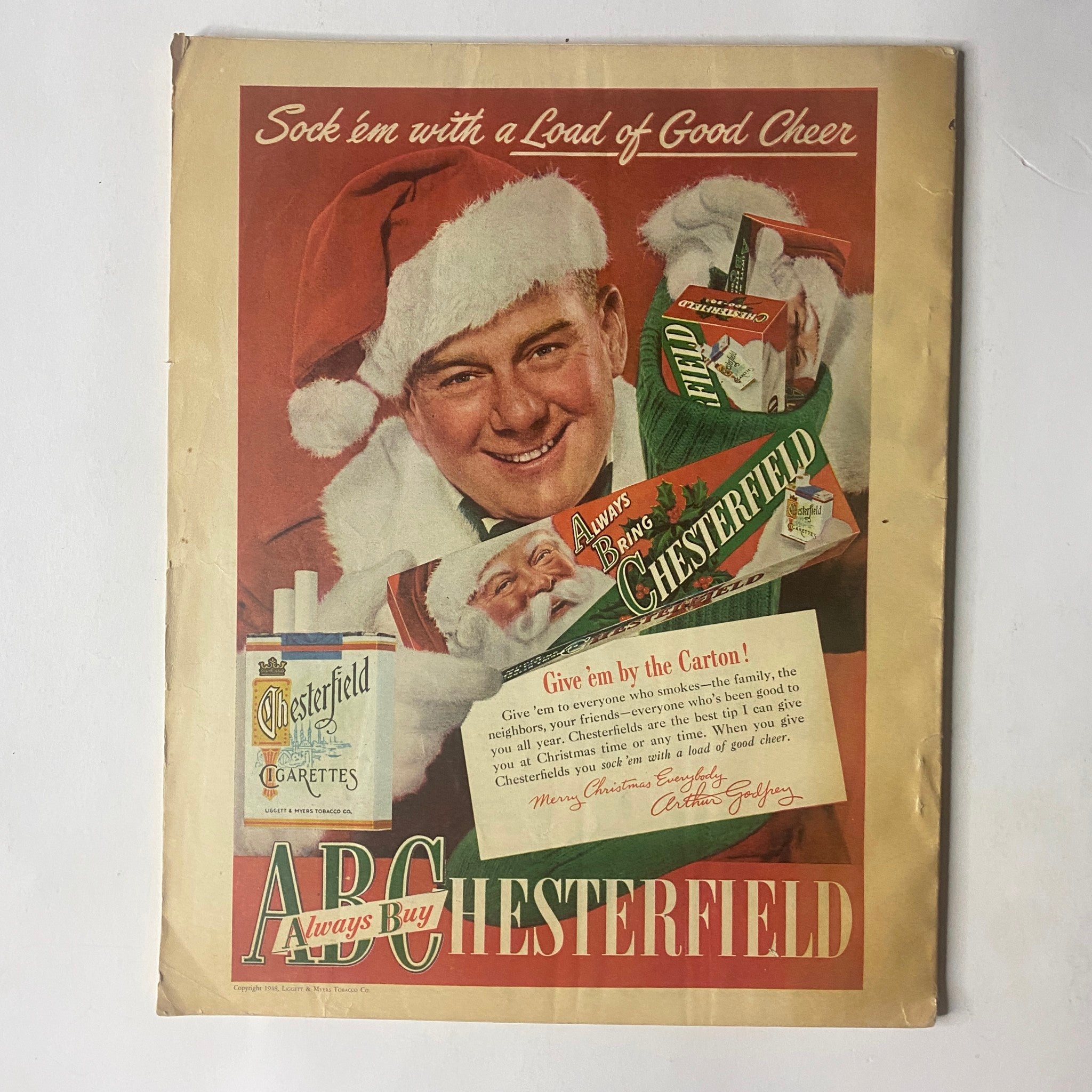 Cover of Radio and TV Mirror Magazine December 1948 featuring Charlie McCarthy and Edgar Bergen, adorned with festive decorations, showcasing a vintage Chesterfield cigarette advertisement. This collectible magazine highlights the charm of 1940s radio and television entertainment.