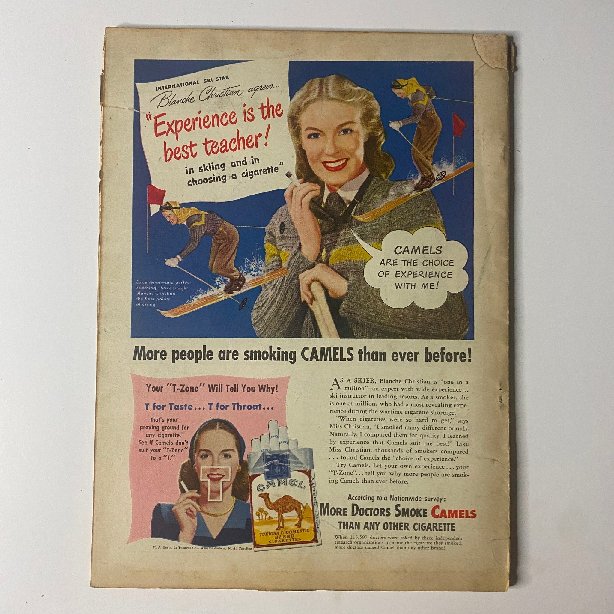 Vintage advertisement from the February 1948 issue of Field & Stream Magazine promoting Camel cigarettes with a skiing theme.