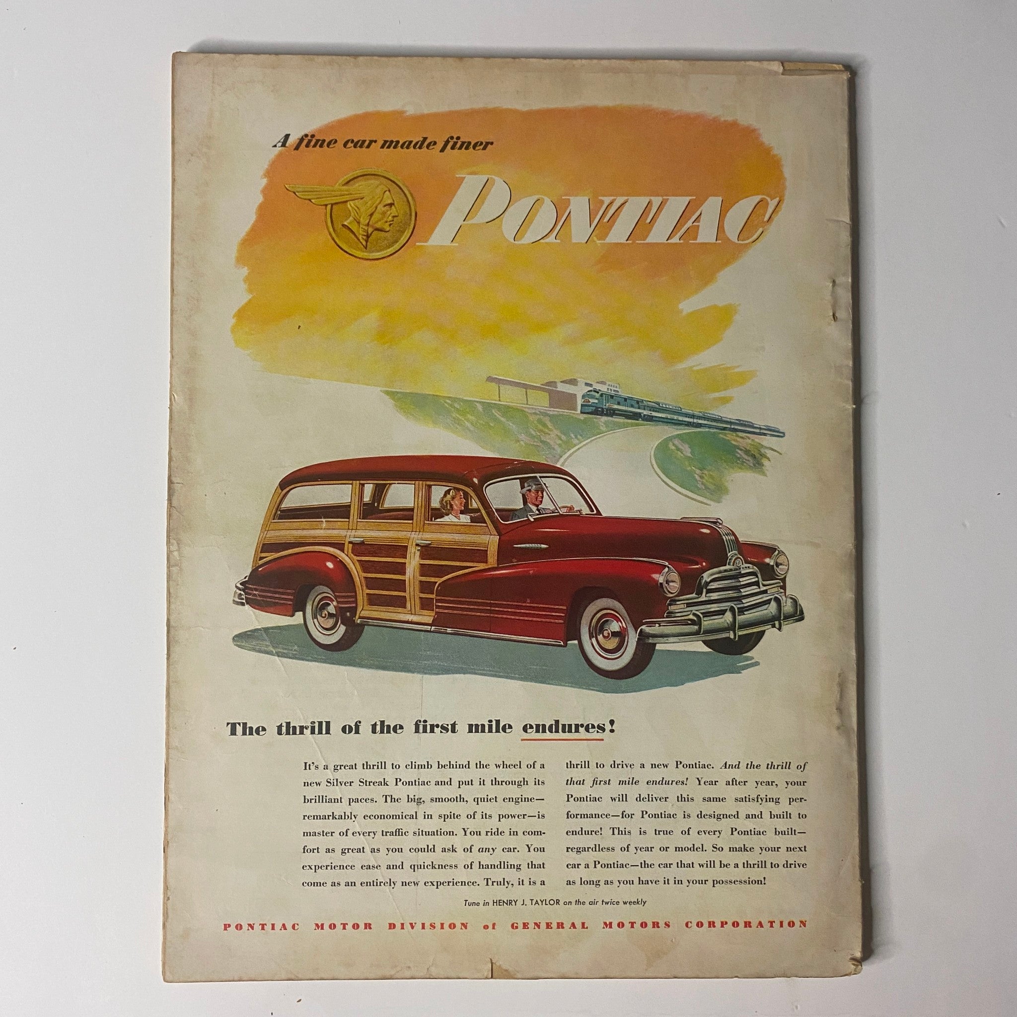 Back cover of Outdoor Life Magazine November 1947 featuring an advertisement for Pontiac, showcasing a vintage automobile with a scenic backdrop.