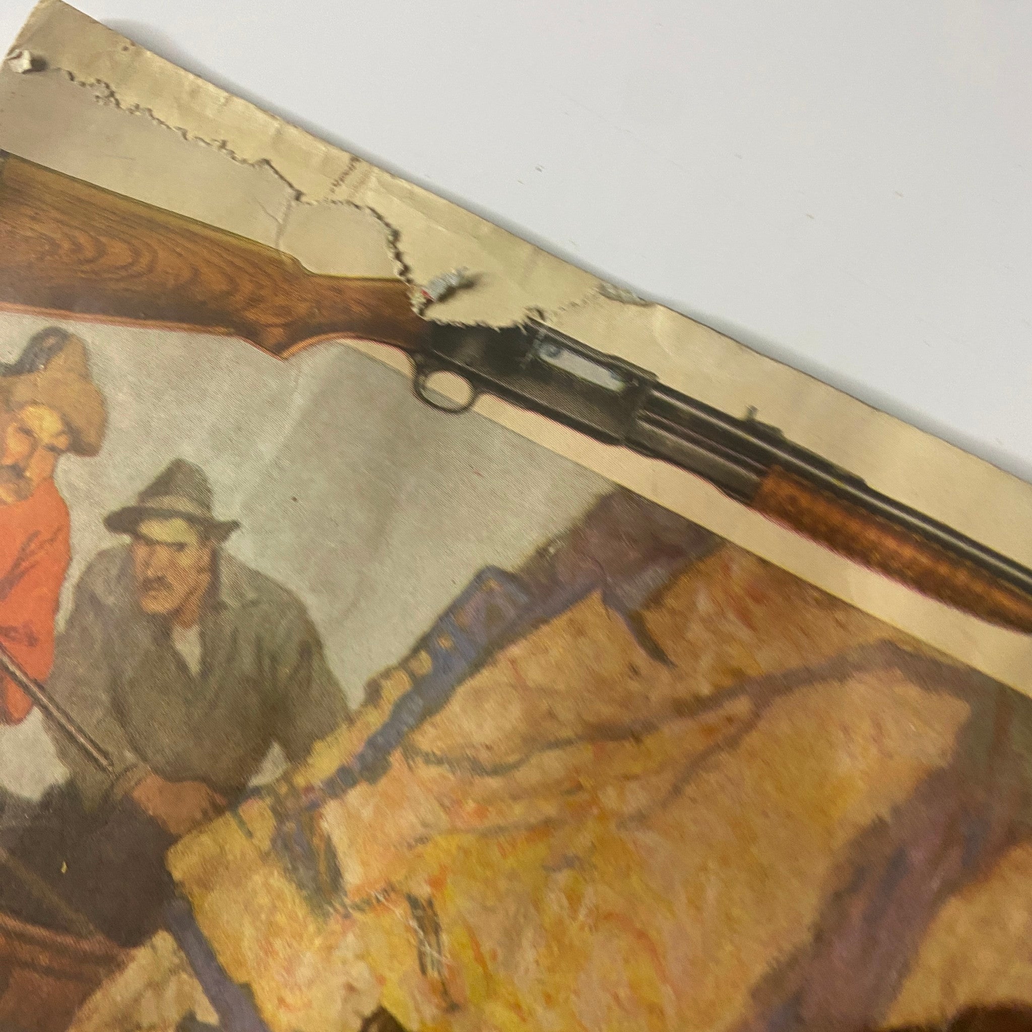 Close-up of a damaged edge on the back cover of Hunter-Trader-Trapper Magazine November 1934, highlighting the magazine's vintage condition and collectible nature.