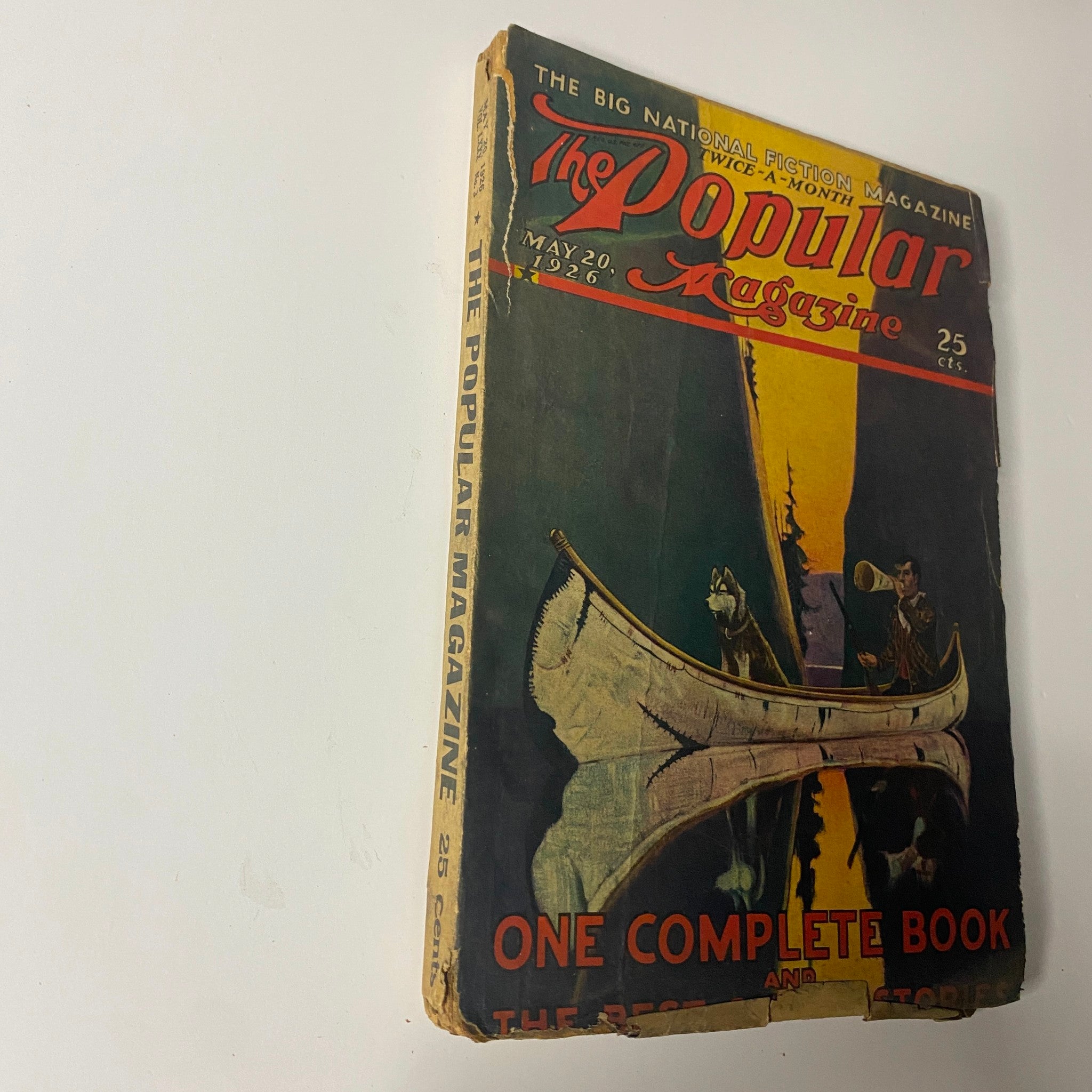 Side view of The Popular Magazine from May 20, 1926 with a colorful cover illustration of a canoe and outdoor scene, depicting the magazine as 'The Big National Fiction Magazine' with a price tag of 25 cents.