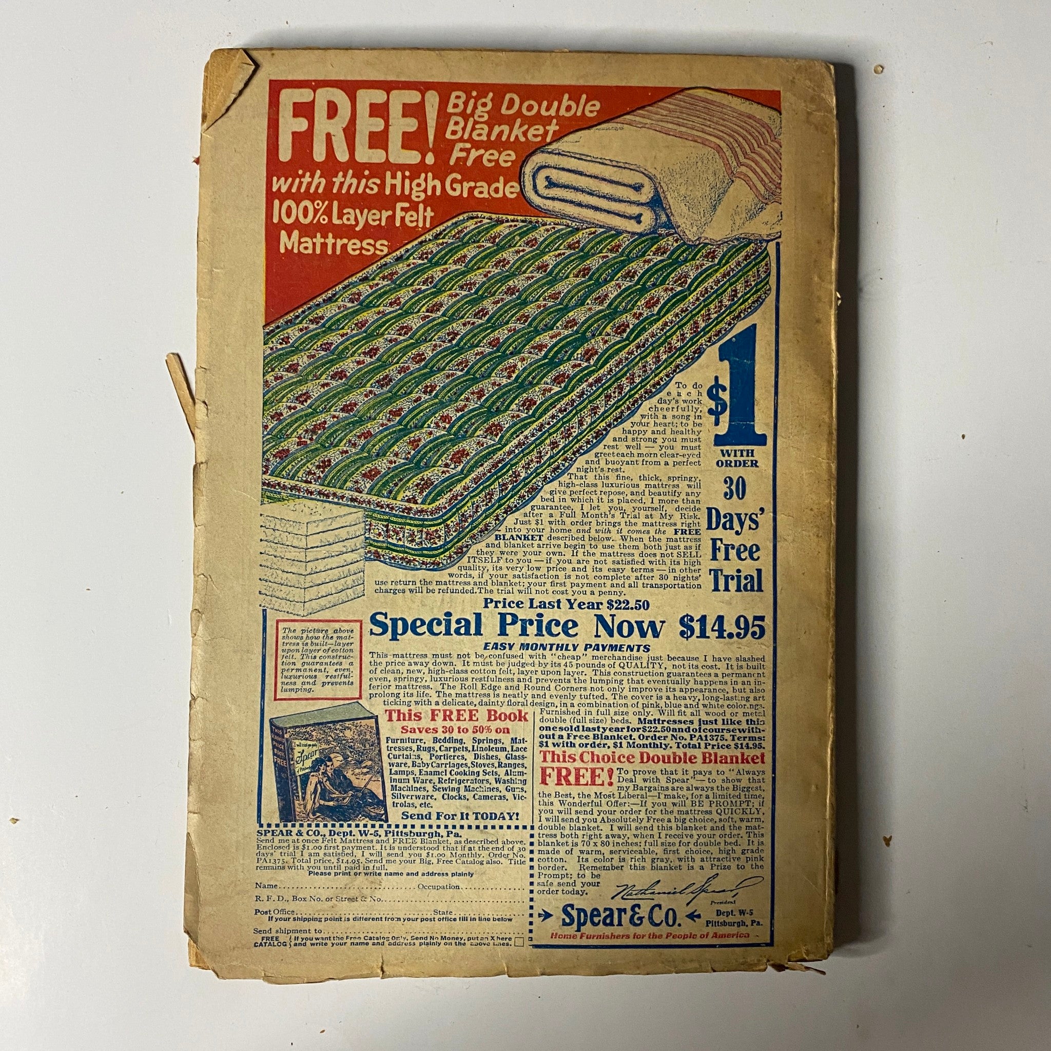 Vintage advertisement page from Argosy All-Story Weekly, September 30, 1922, featuring a promotional offer for a free double blanket with the purchase of a 100% layer felt mattress priced at $14.95, emphasizing value and home comfort.