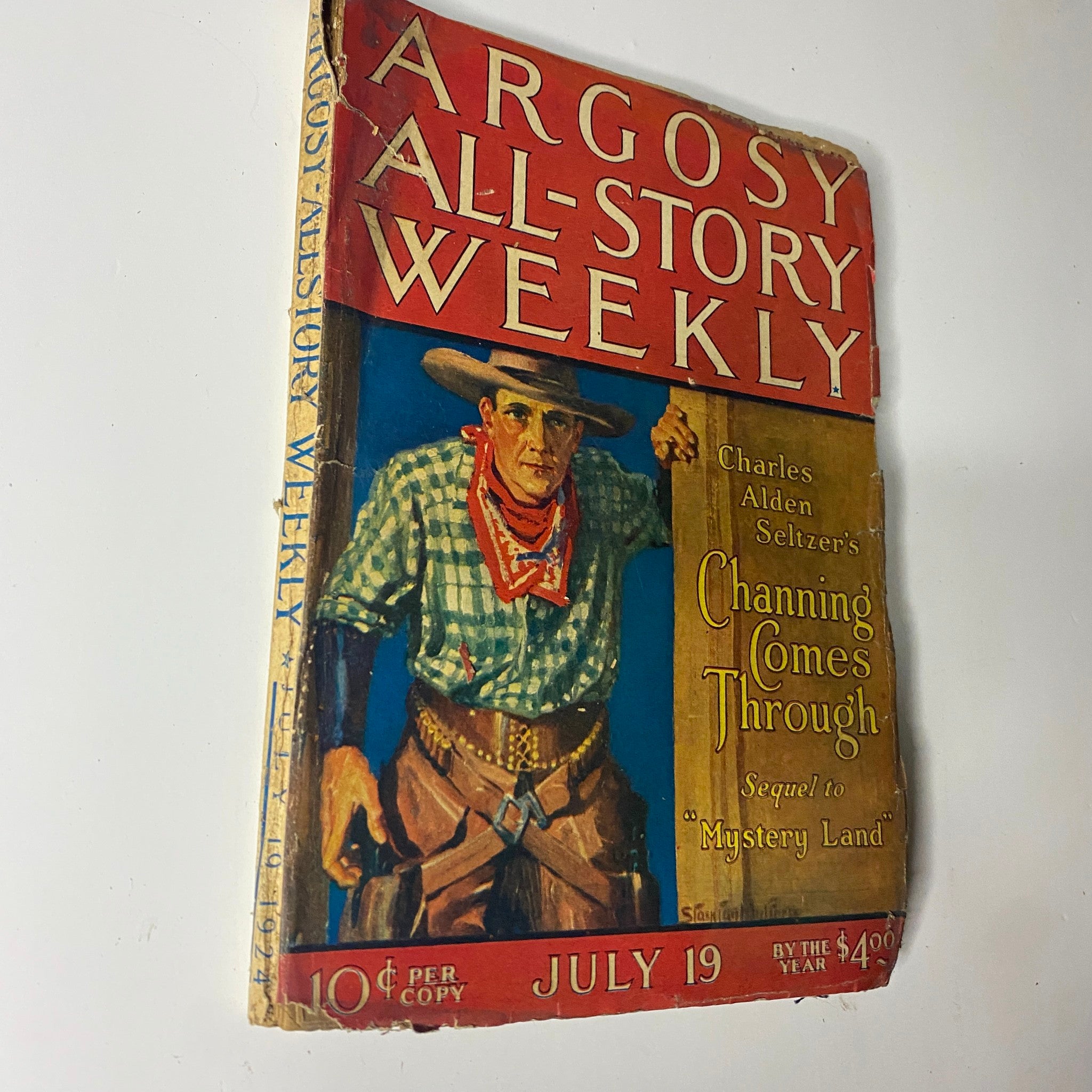 Front cover image of Argosy All-Story Weekly, July 19, 1924, showcasing the story 'Channing Comes Through' by Charles Alden Seltzer, depicting a rugged cowboy.
