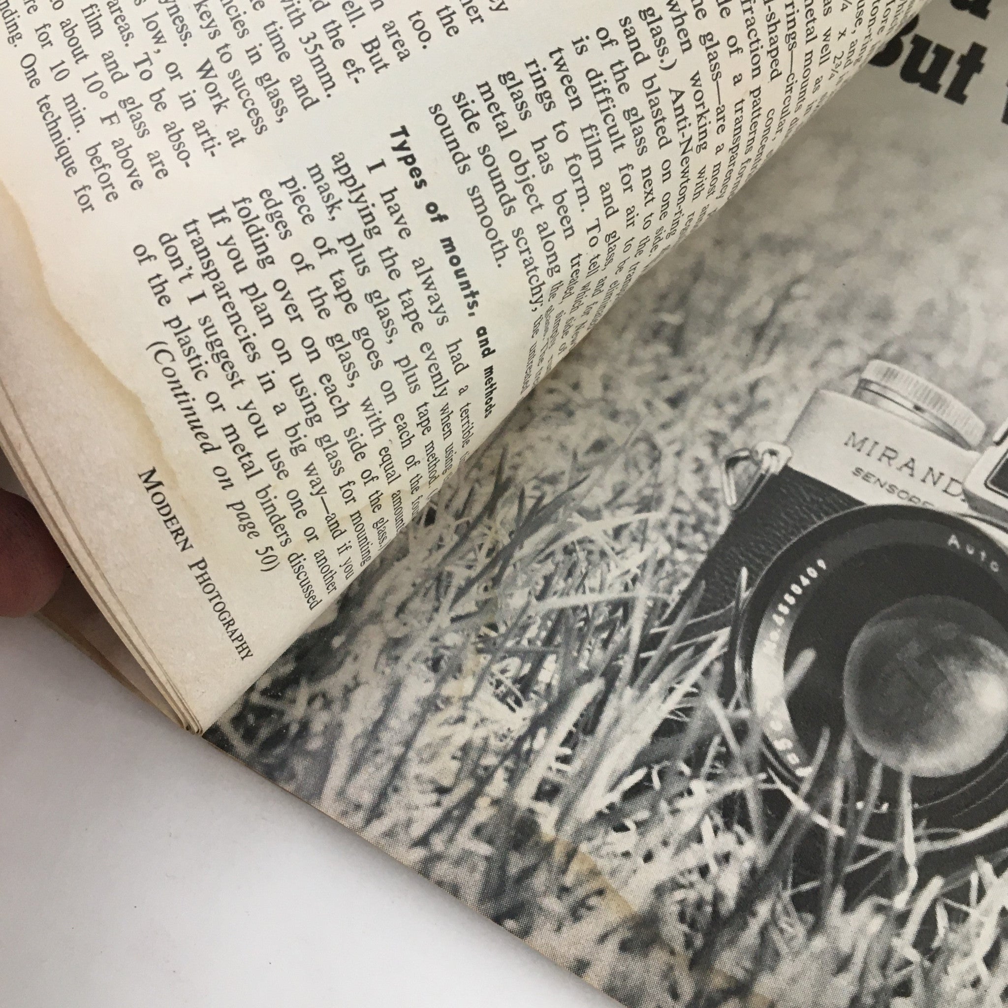 A page from Modern Photography Magazine October 1967 featuring a photograph of a Miranda camera on grass, emphasizing photography techniques of the time.