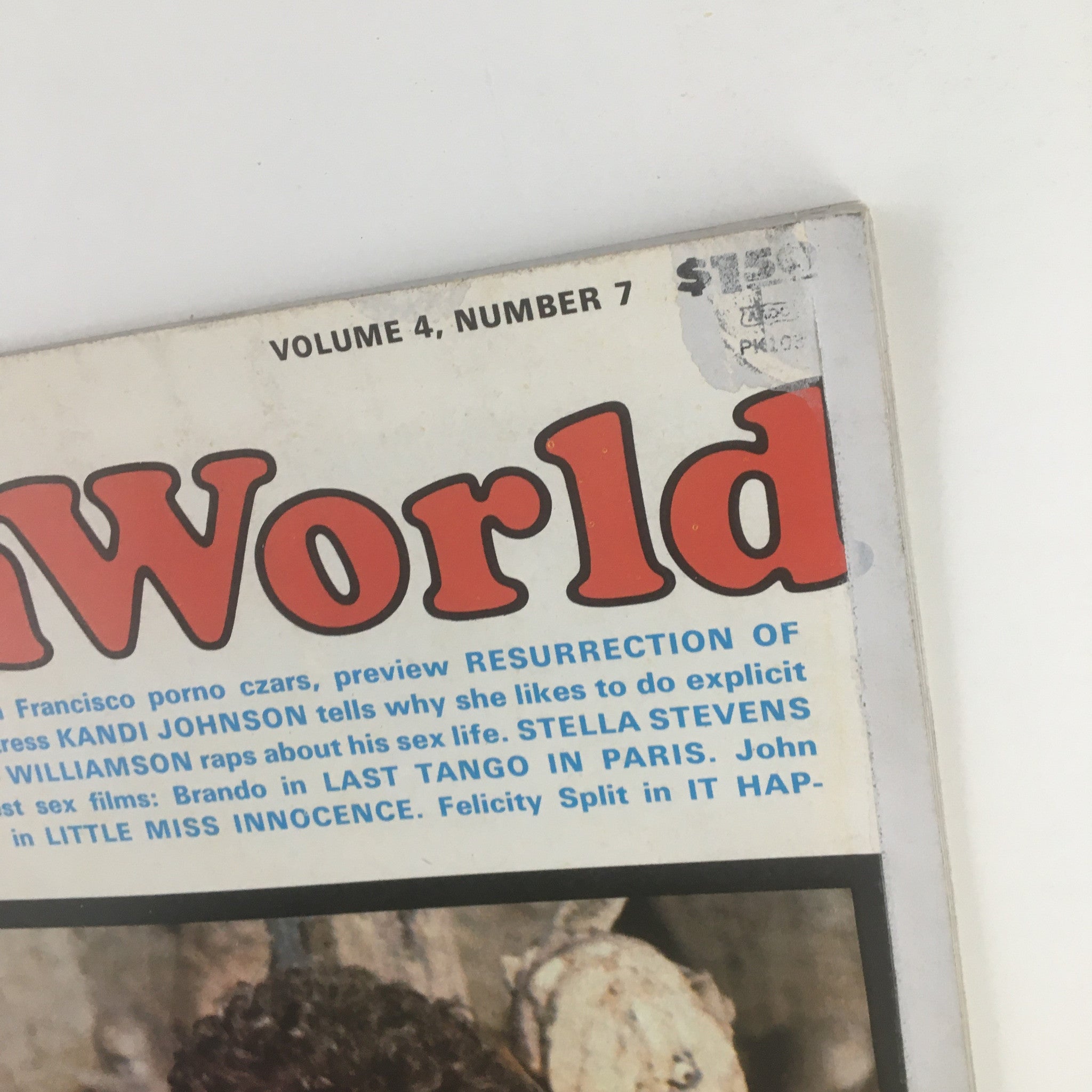 Close-up of Adam Film World Magazine August 1973, emphasizing the title and subtitle with a brief description of the contents related to the entertainment industry.